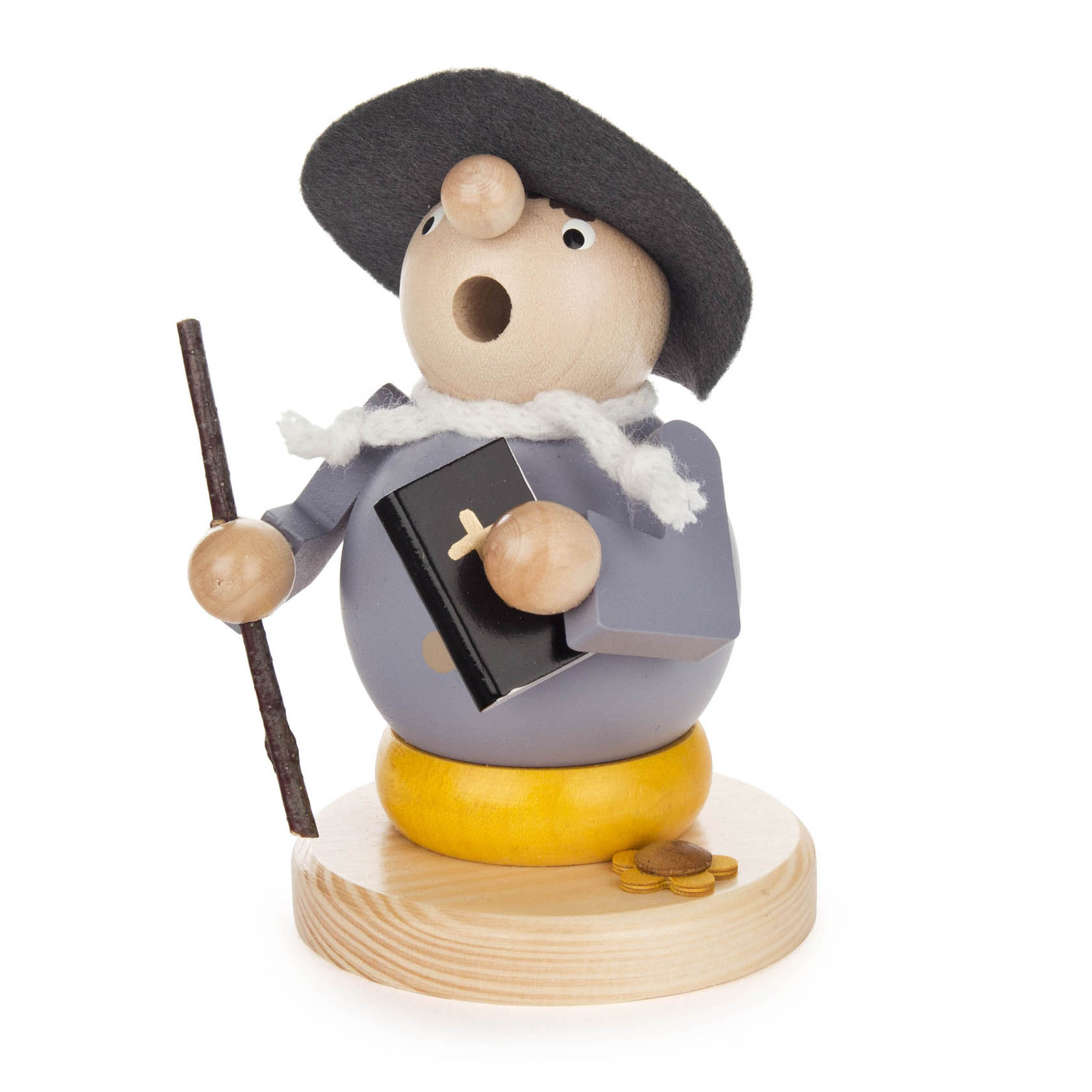 Ein Räuchermann aus Holz, dargestellt als Martin Luther mit einer Bibel in der Hand, einem schwarzen Hut, einem grauen Mantel und einem Stock.