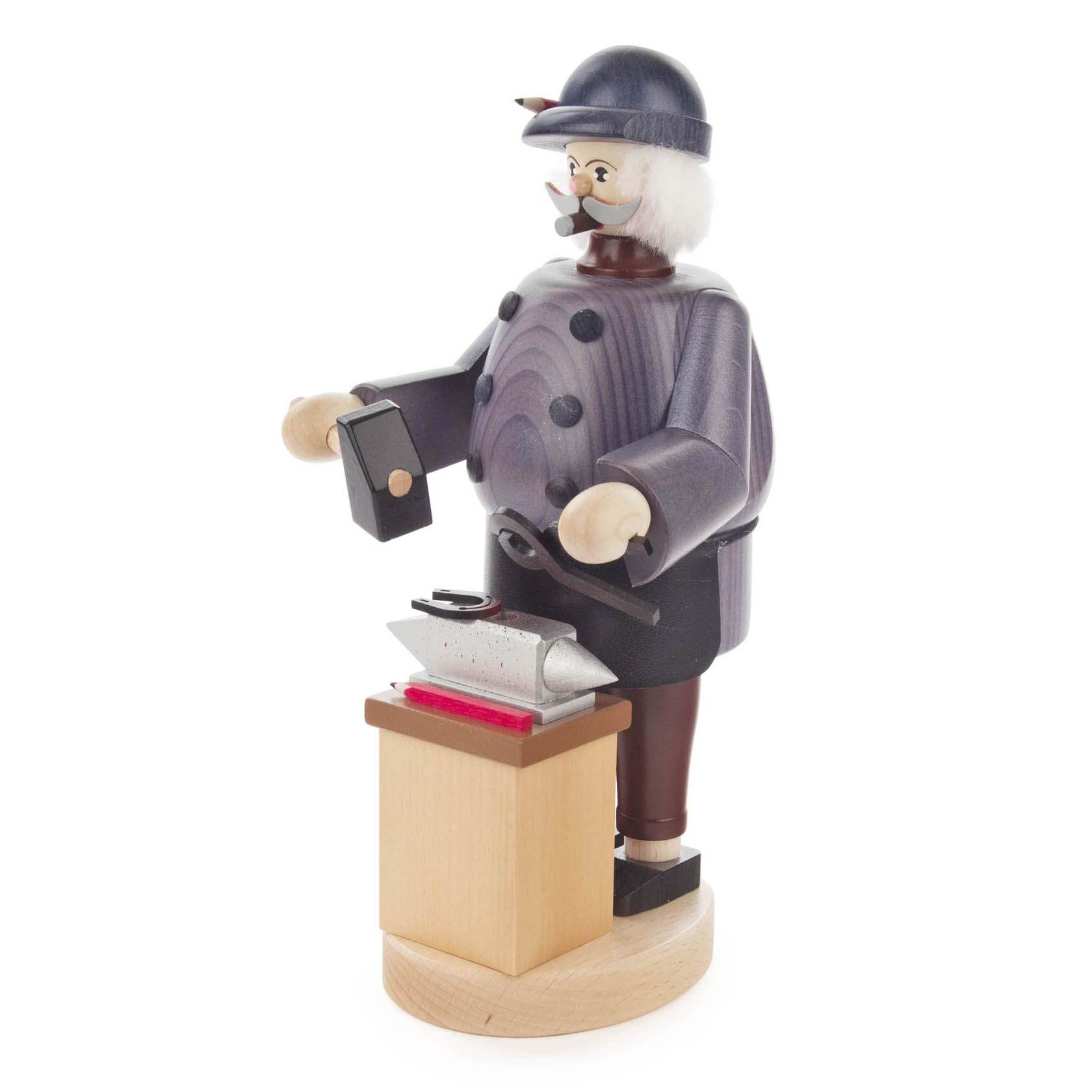 Wooden incense smoker figure of a blacksmith with a hammer, wearing a cap, standing at an anvil on a wooden base.