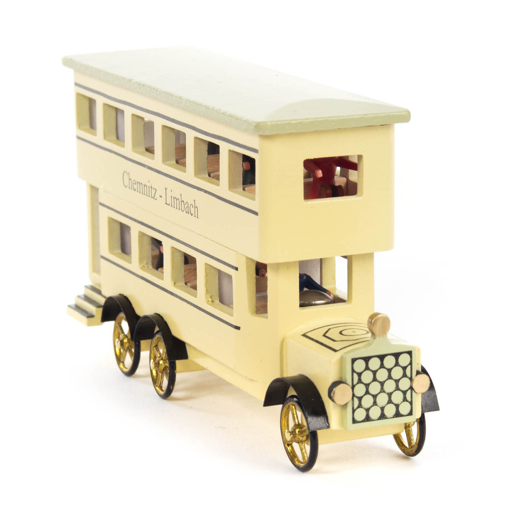 A miniature double-decker bus model painted in cream with yellow and black details, featuring a label 'Chemnitz - Limbach' and gold-colored wheels.