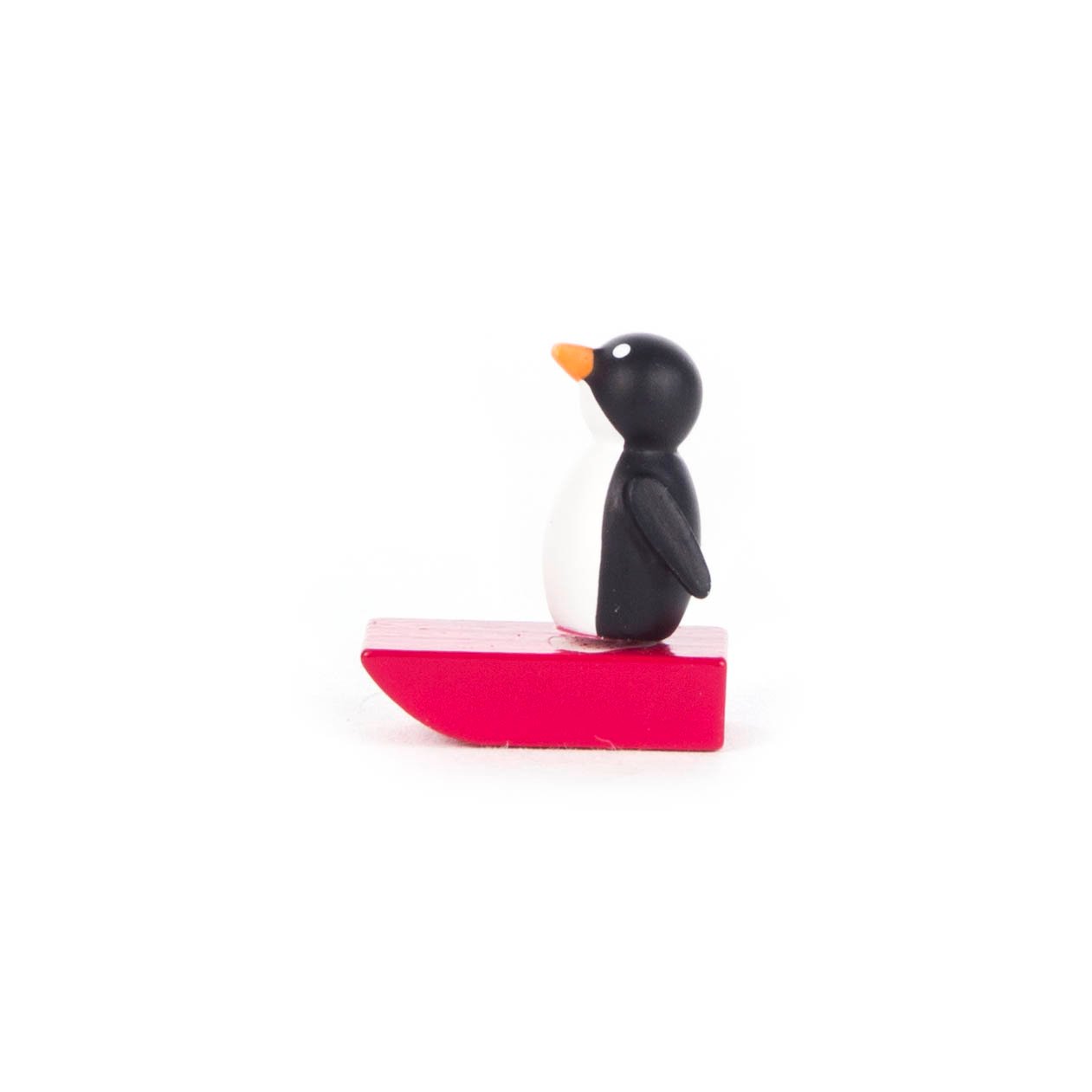 Pinguin auf Schlitten klein, rot