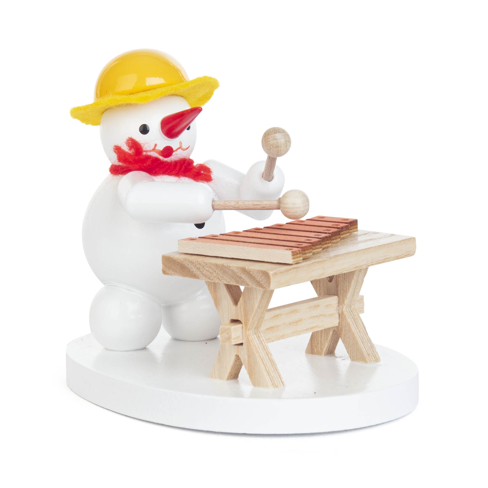 Ein Schneemann mit gelbem Hut und rotem Schal spielt auf einem kleinen Tisch-Xylophon. im Dregeno Online Shop günstig kaufen