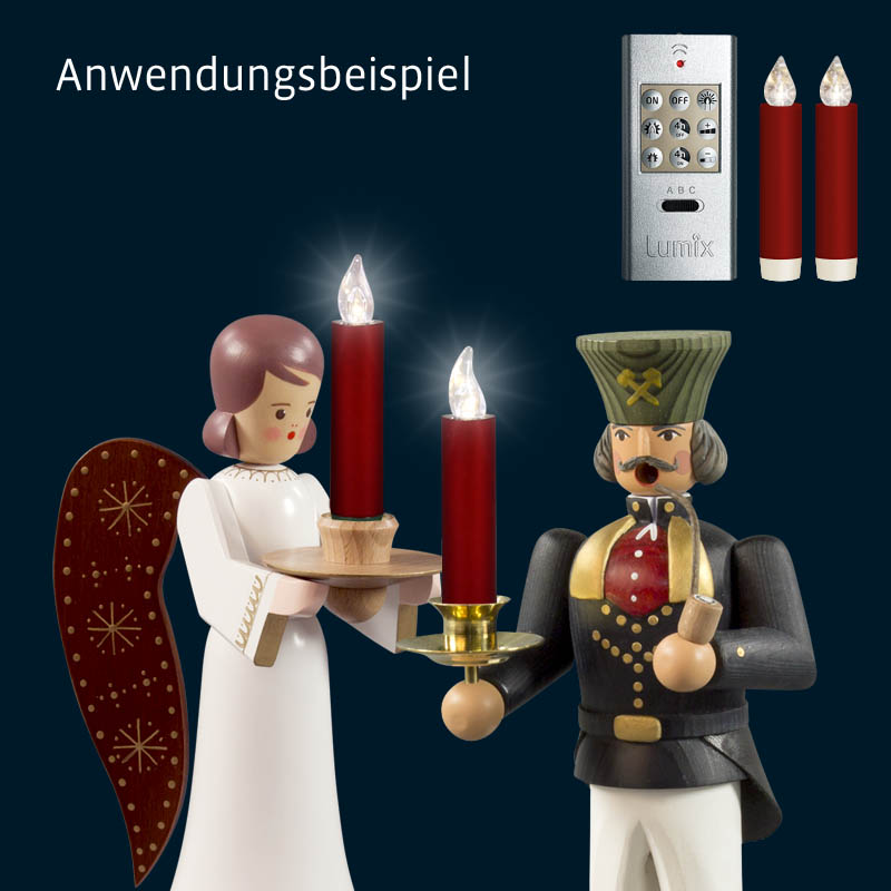 Traditional wooden figurines holding a candle, with a remote control and two red LED candles on the side.