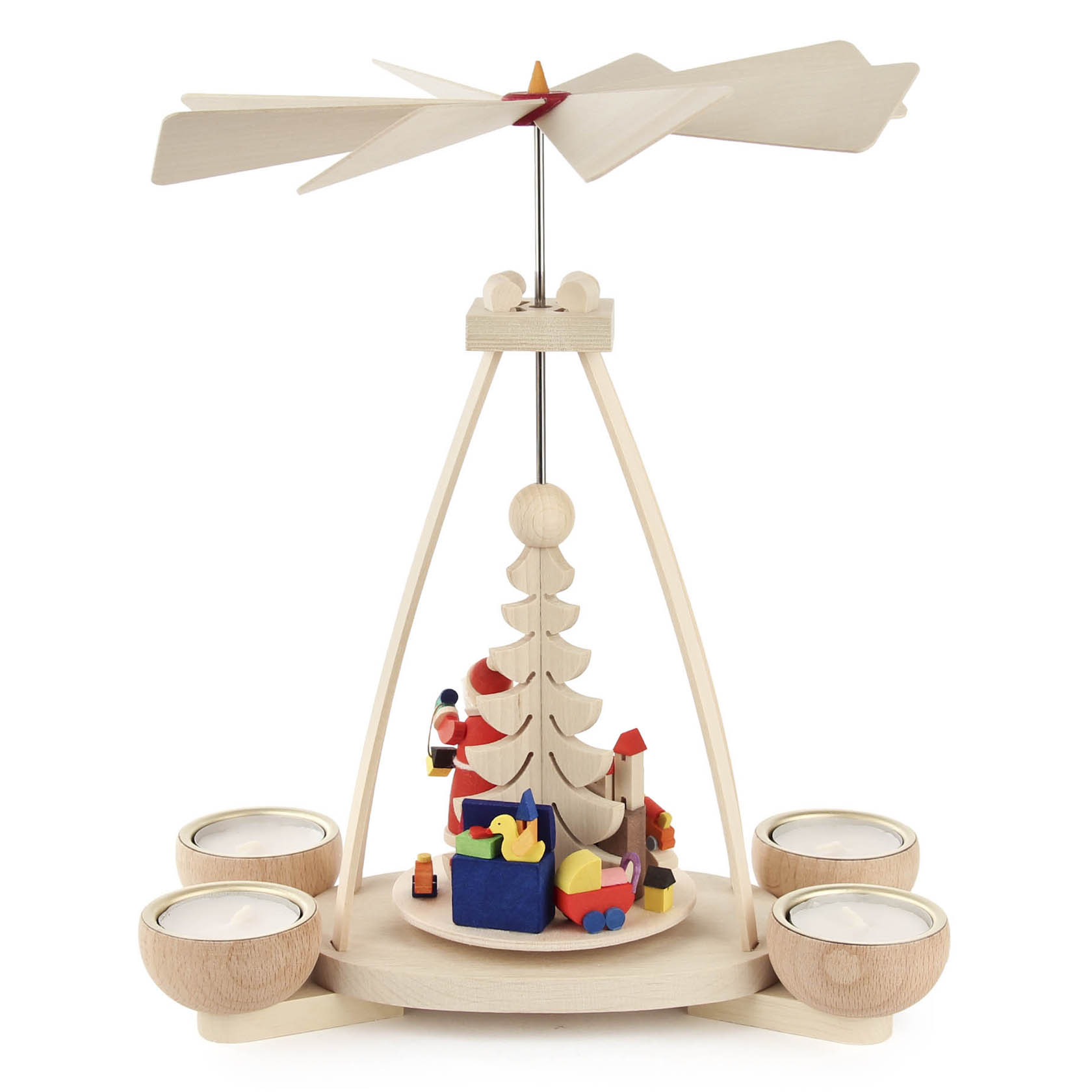 German Christmas pyramid with Santa Claus, gifts, and tea light holders. Wooden blades on top spin with heat from candles.