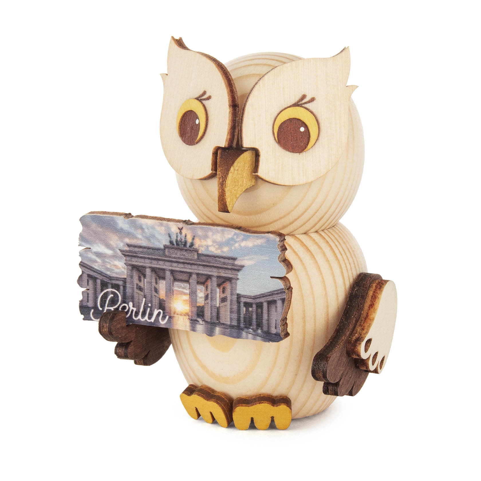 A small wooden owl figure holding a plaque with an image of the Brandenburg Gate and the word 'Berlin' inscribed on it. im Dregeno Online Shop günstig kaufen