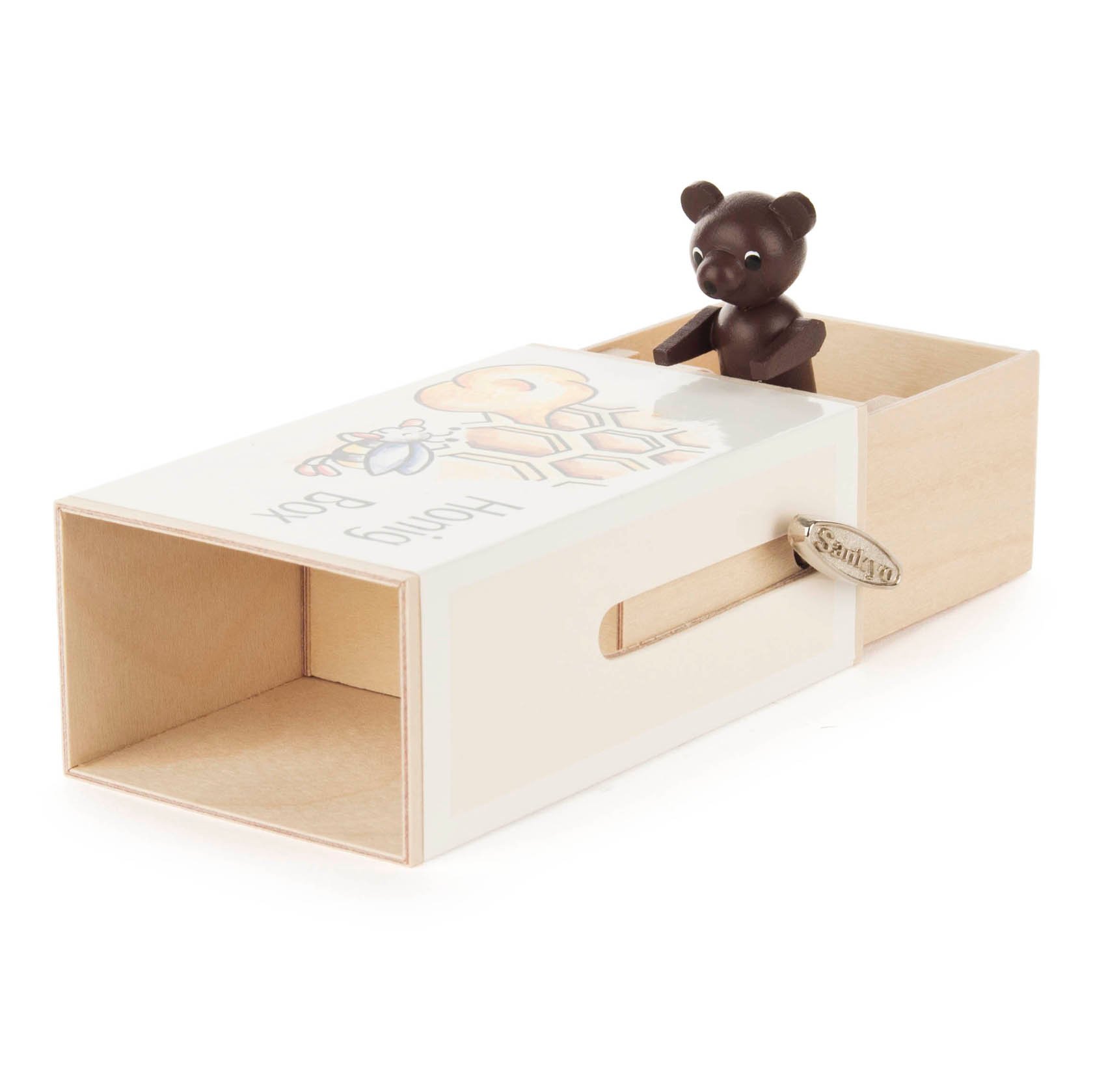 Kleine hölzerne Schiebebox mit der Aufschrift 'Honig-Box'. Ein dunkelbrauner Bär schaut aus der Schublade heraus. Es ist eine Spieluhr mit der Melodie 'Bienchen summ herum'.