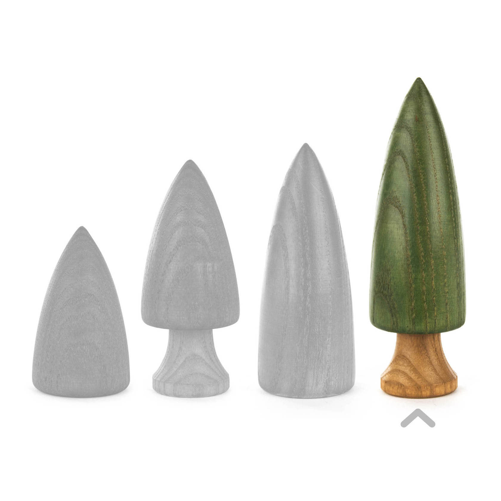 A green wooden tree with a defined trunk, approximately 12.5 cm tall, standing beside three unpainted wooden trees.
