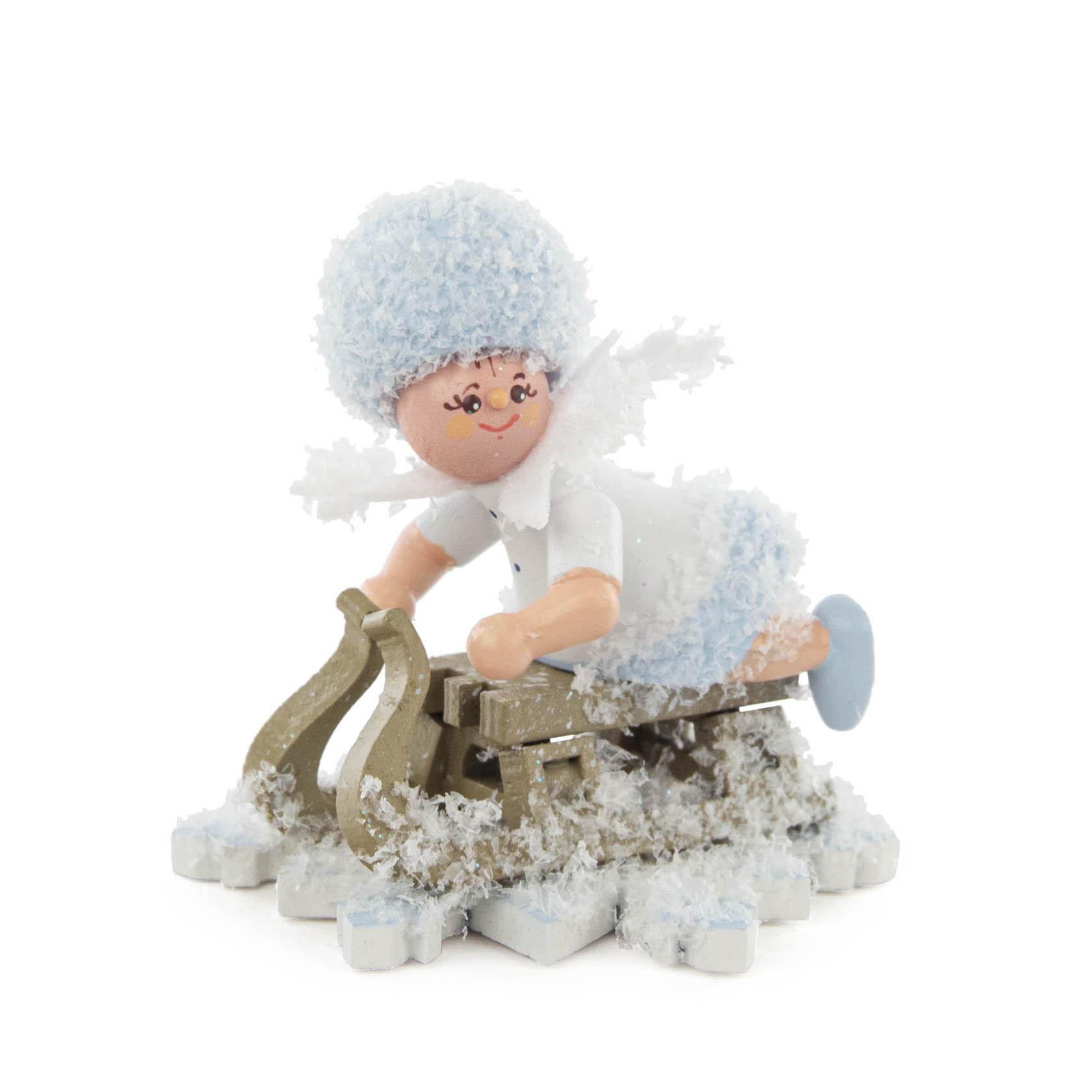 A snowflake-themed figurine of a child dressed in blue and white winter clothing riding a wooden sled decorated with artificial snow. im Dregeno Online Shop günstig kaufen