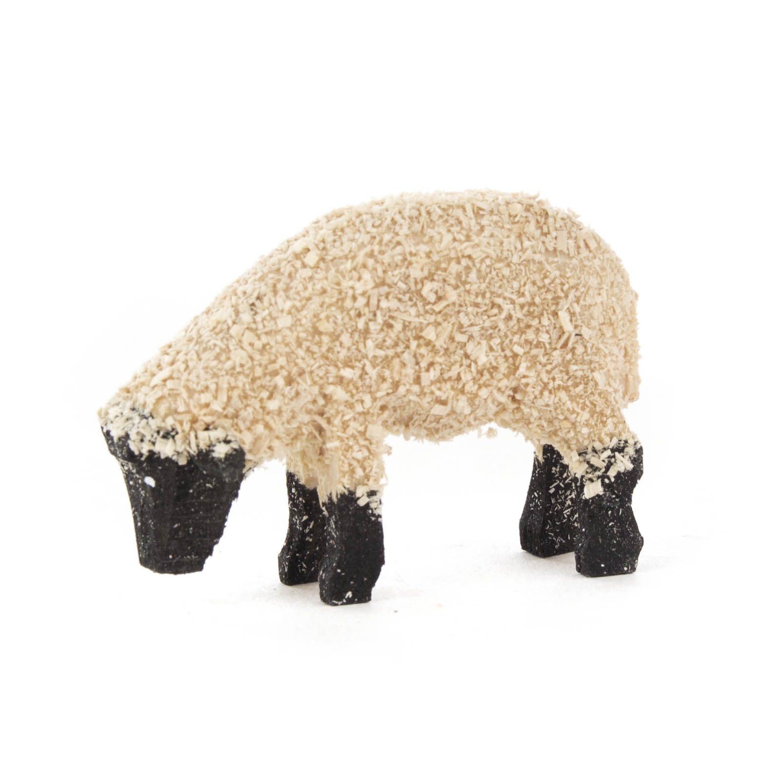 Ein schwarzes Schafmodell mit wollweißer Hülle im vorderen Bereich, das den Kopf nach unten gesenkt hat, als ob es frisst. im Dregeno Online Shop günstig kaufen
