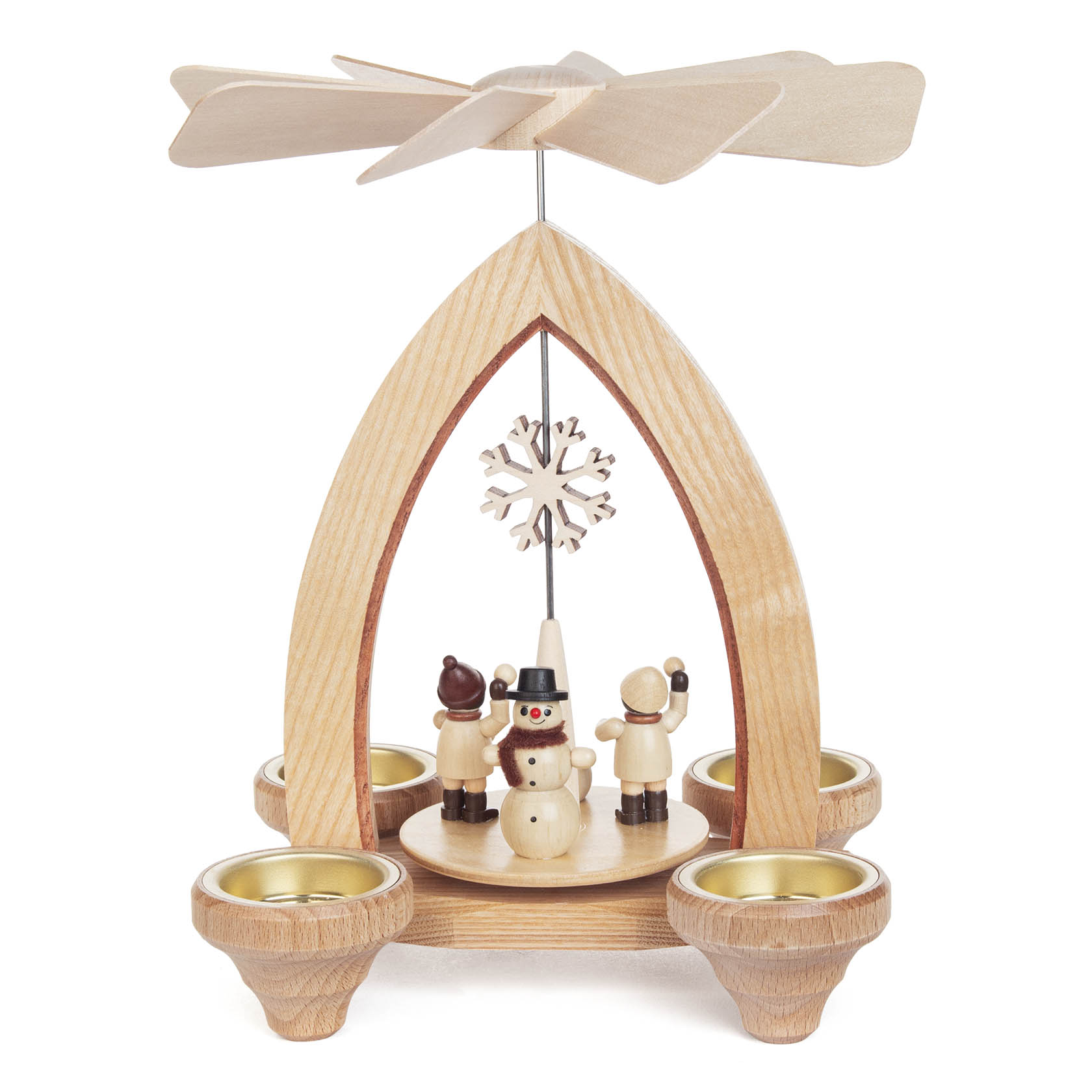 A wooden candle holder pyramid with a snowball fight scene of three wooden figurines around a snowman, featuring a rotating fan above.