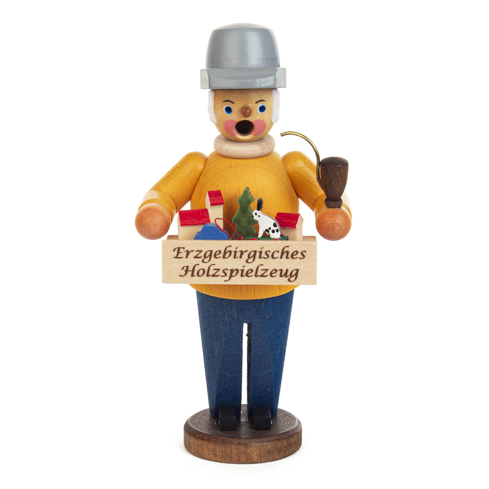 Mini-Räuchermann in Form eines Spielzeughändlers mit grauem Hut, gelbem Oberteil, blauer Hose und Pfeife. Er trägt eine Kiste mit Erzgebirgischem Holzspielzeug. im Dregeno Online Shop günstig kaufen