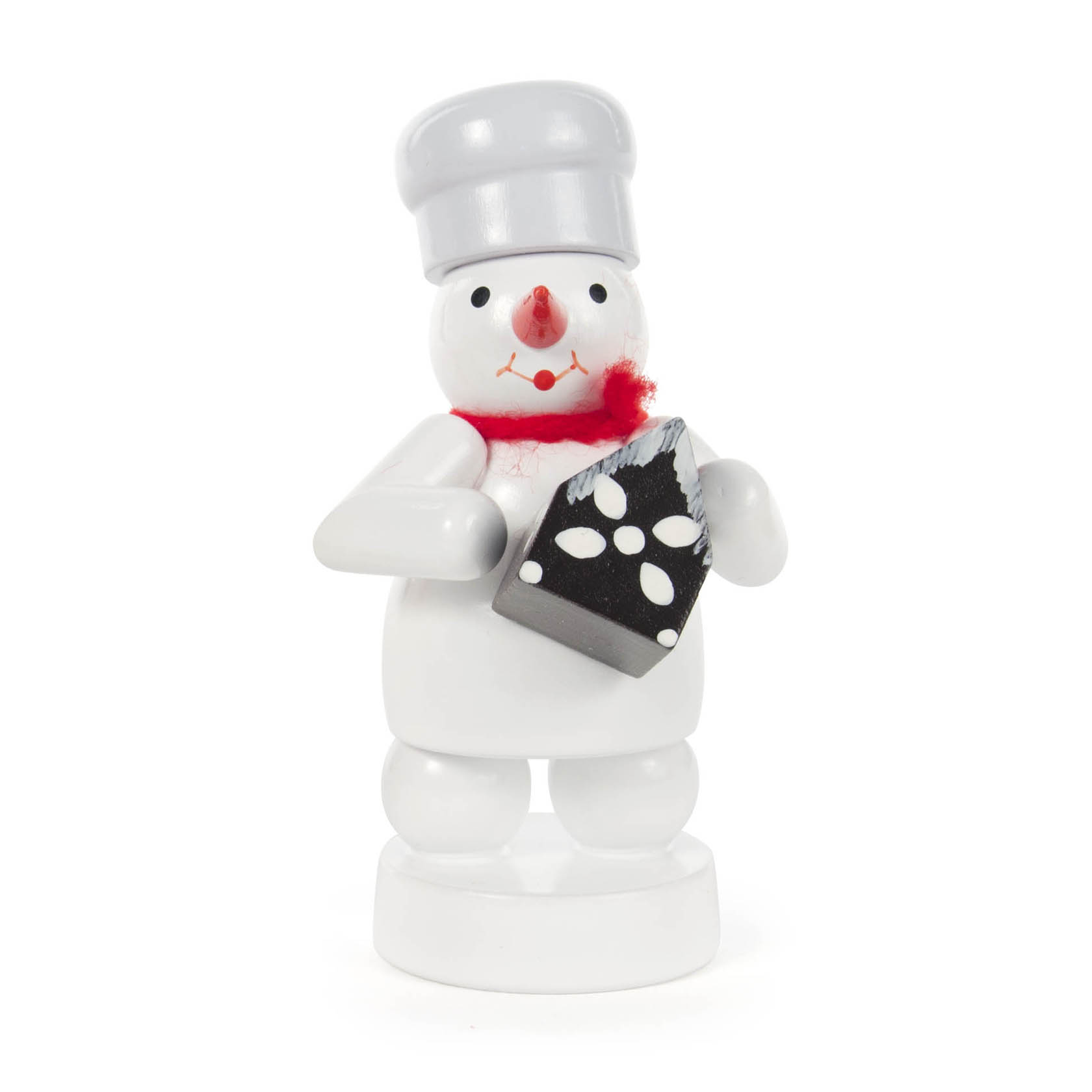 Kleiner Schneemann in Bäcker-Outfit mit Mütze, der ein schwarz-weißes Pfefferkuchenhaus in den Händen hält. im Dregeno Online Shop günstig kaufen