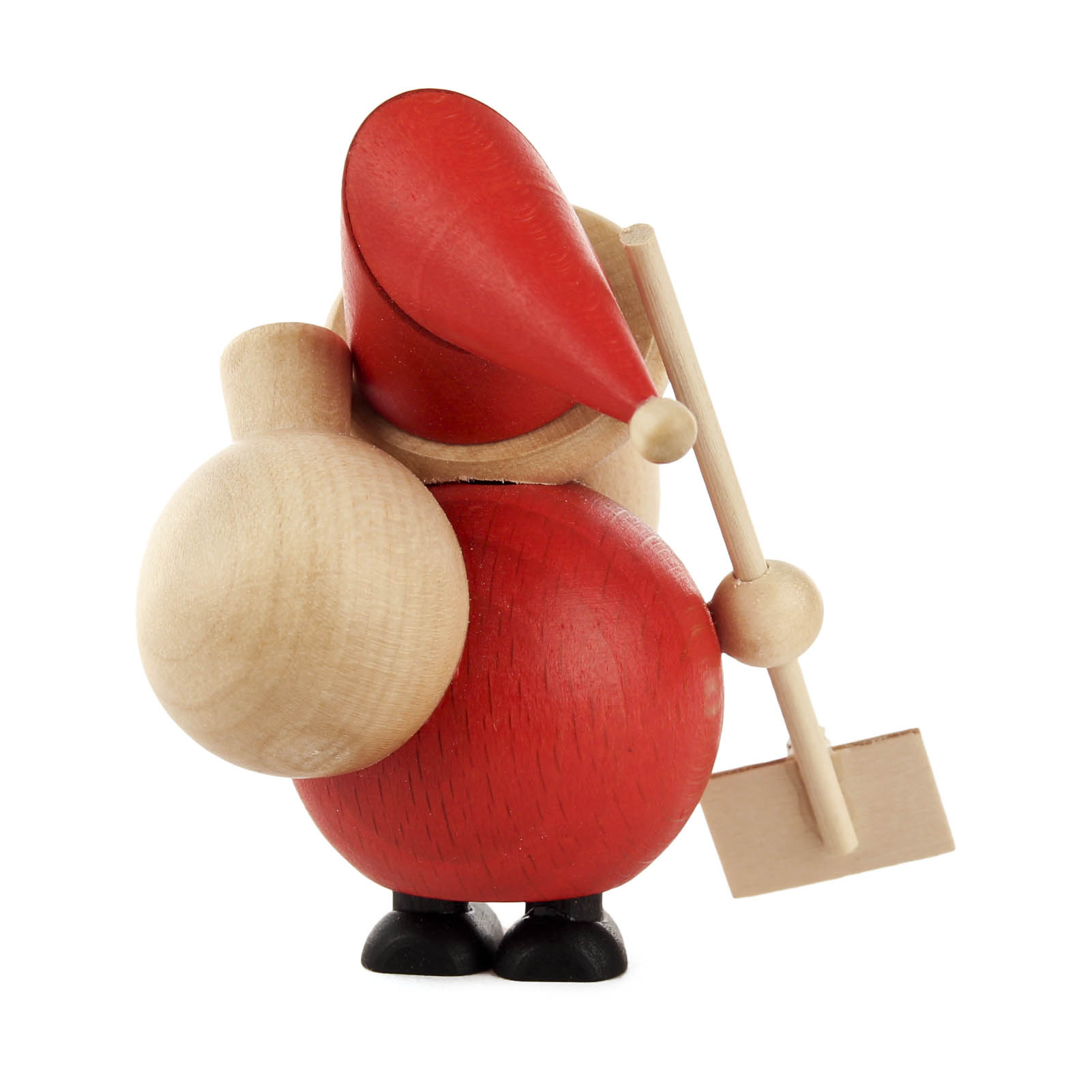 Holzfigur eines Weihnachtsmanns mit rotem Körper und Mütze, der eine Schneeschaufel in der rechten Hand und einen Sack über der Schulter hält.