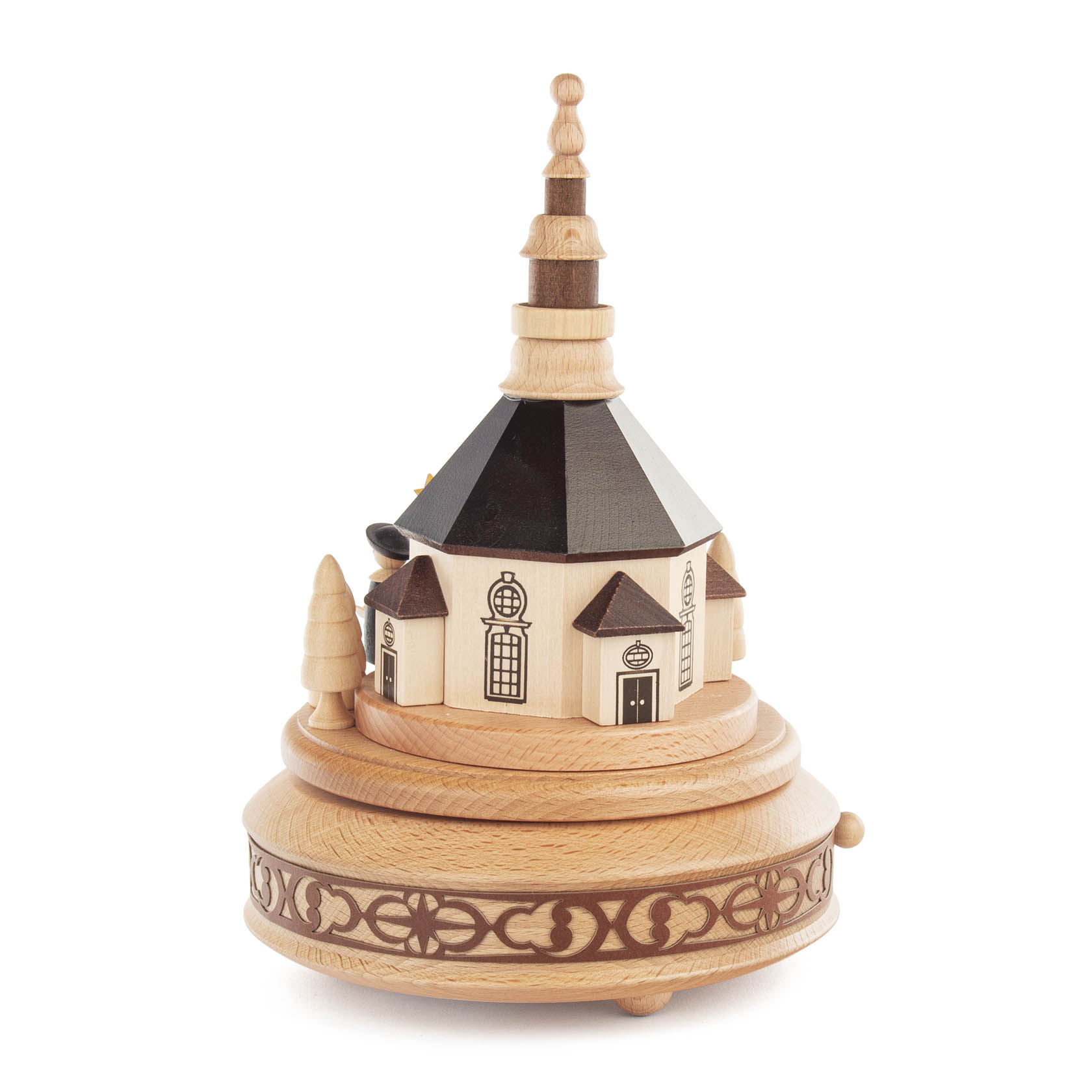 Wooden music box featuring the Seiffen Church and carolers. The music box has a circular base with decorative patterns.