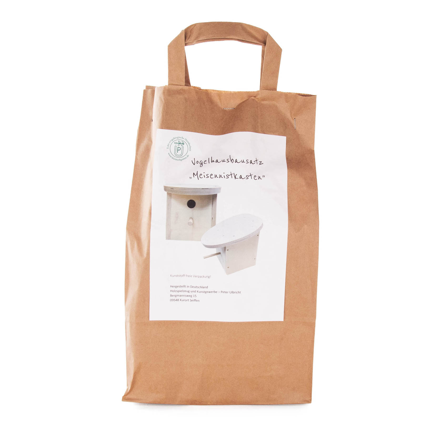 A brown paper bag labeled 'Bastelset Vogelhaus Meisenkasten' with a small image of an unassembled birdhouse kit on the front.