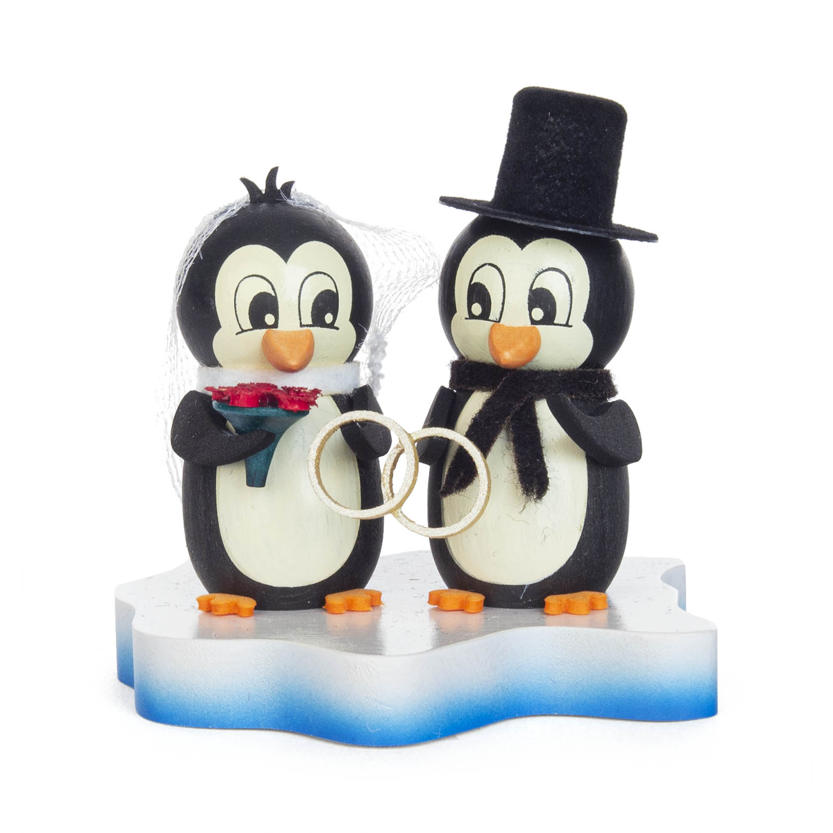 Zwei Pinguinfiguren, einer trägt einen Schleier und hält einen Blumenstrauß, der andere hat einen Zylinderhut und einen Schal; sie halten zusammen Eheringe. im Dregeno Online Shop günstig kaufen