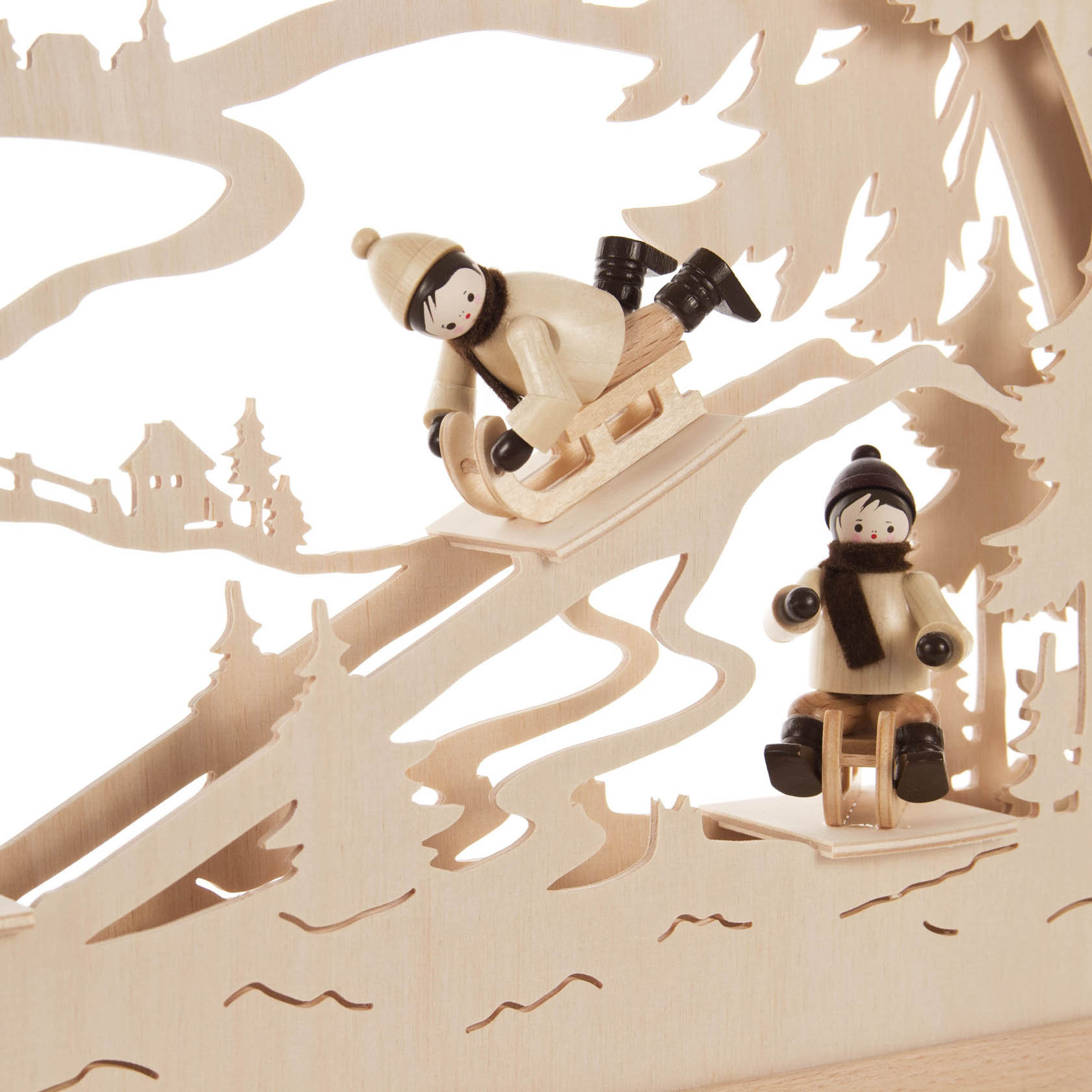 Two wooden figures sledding down a hill. The figures are wearing winter clothing and hats, mounted on a crafted arch with an electric LED band.