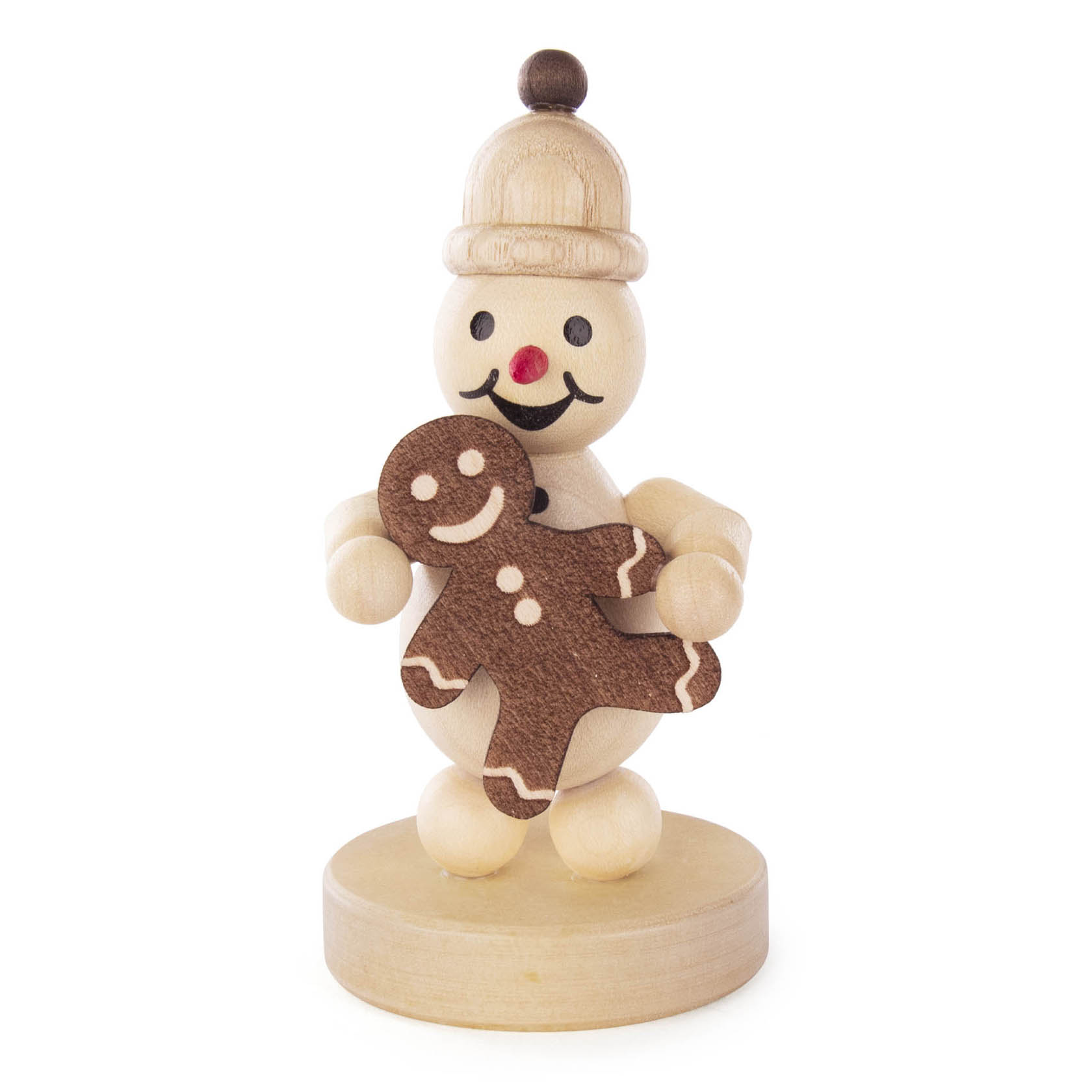 Ein hölzerner Schneemann Junior mit einem Lebkuchenmann in den Händen, trägt eine Mütze und hat ein freundliches Gesicht mit roter Nase. im Dregeno Online Shop günstig kaufen