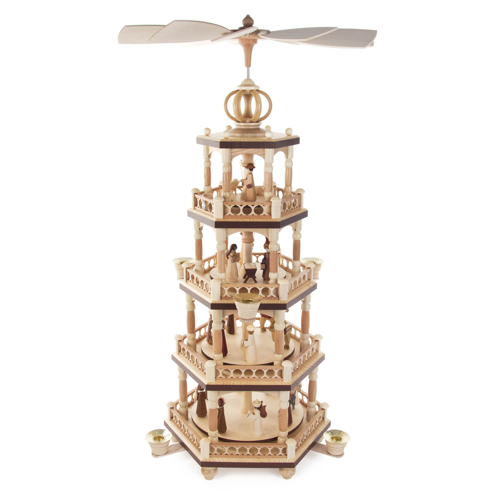 Four-tiered wooden pyramid carousel depicting Nativity scene with figures including Mary, Joseph, baby Jesus, and shepherds, designed for candles.