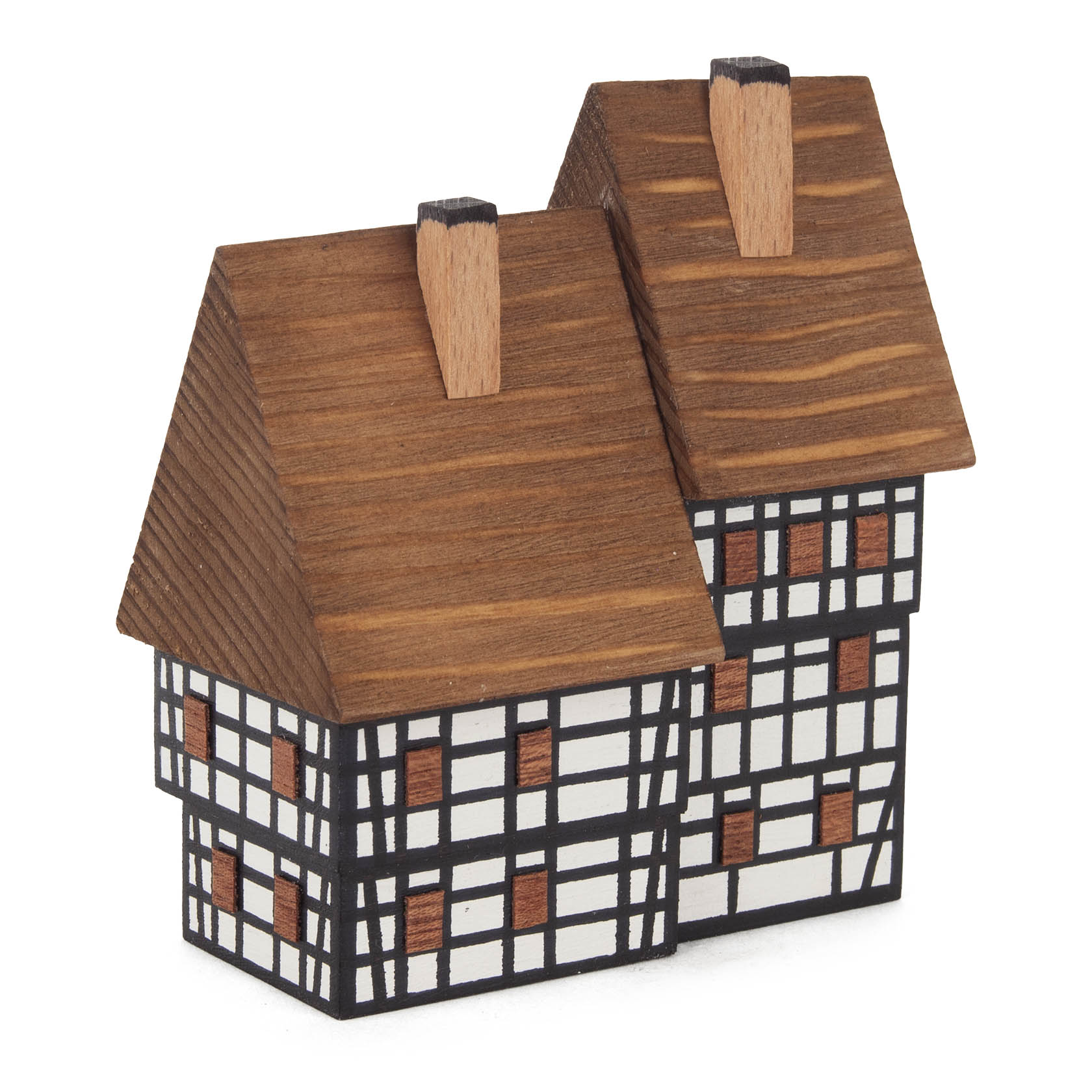 Wooden model of a town-style semi-detached house, featuring a black and white checkered facade and brown wooden roofs, representing traditional architecture.