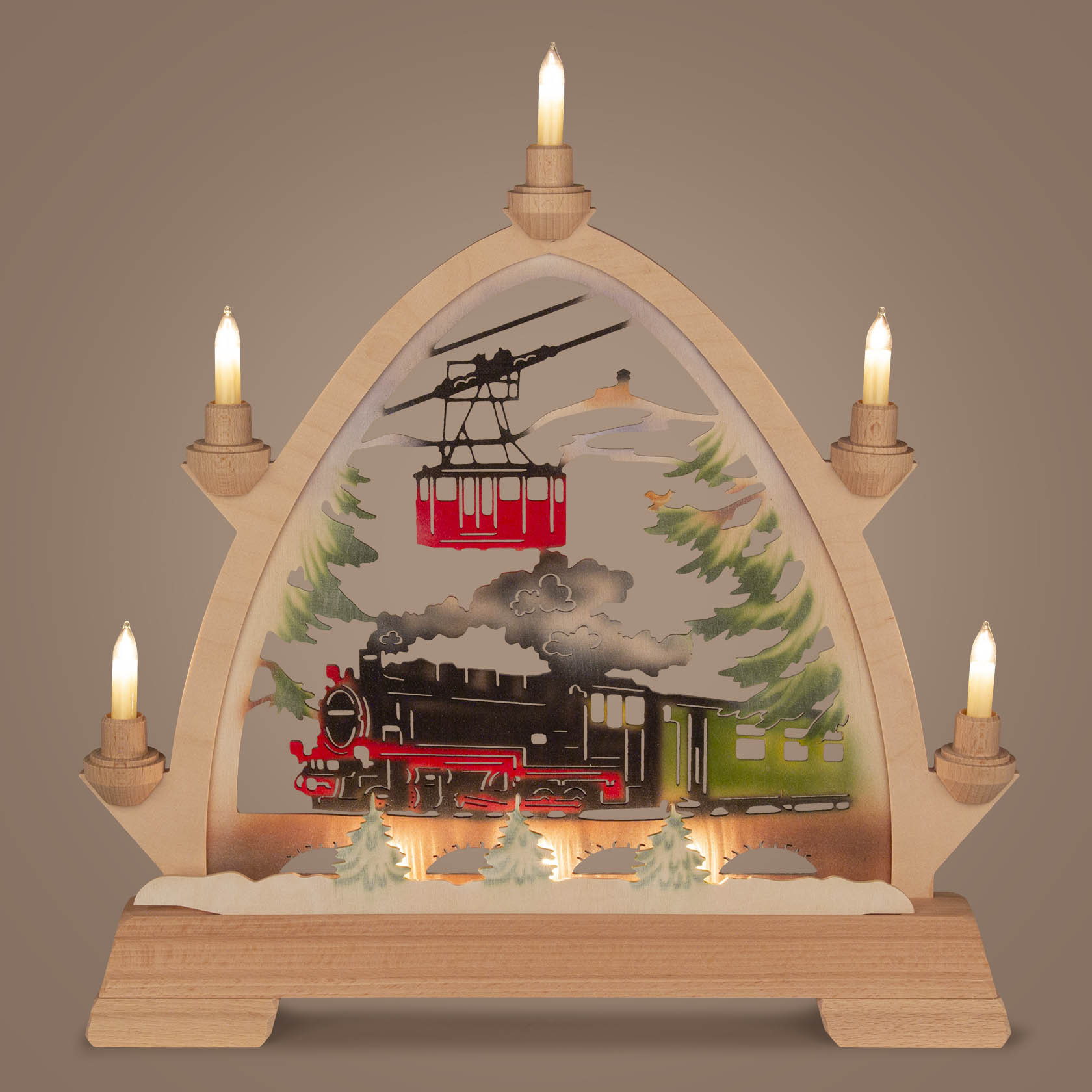 A colorful arch-shaped wooden candle holder with small candlesticks. It features a scene of a steam train labeled 'Fichtelbergbahn' and a cable car.