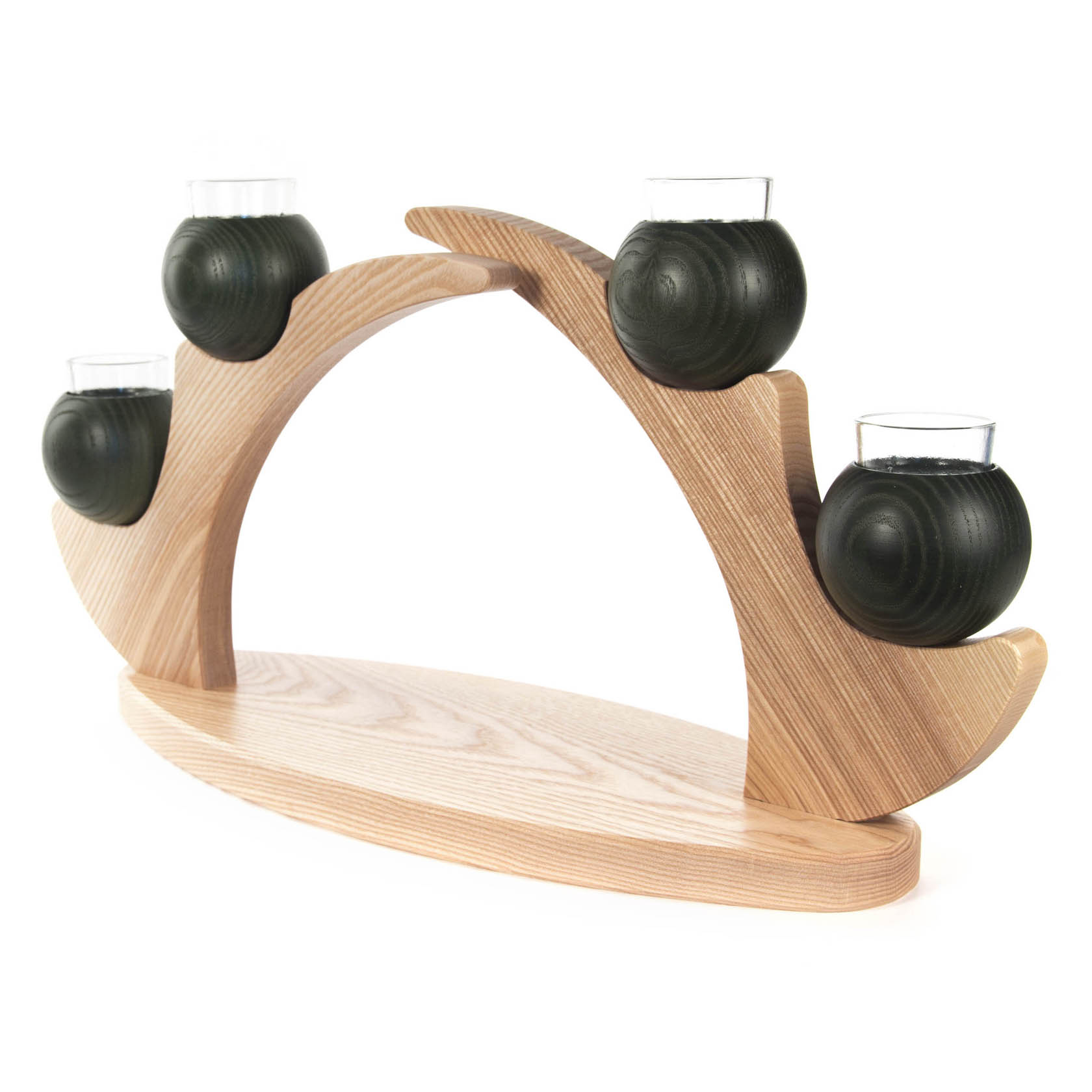 A wooden candle holder for four candles, featuring an elegant arch design with green wooden spheres holding small glass cups for candles.