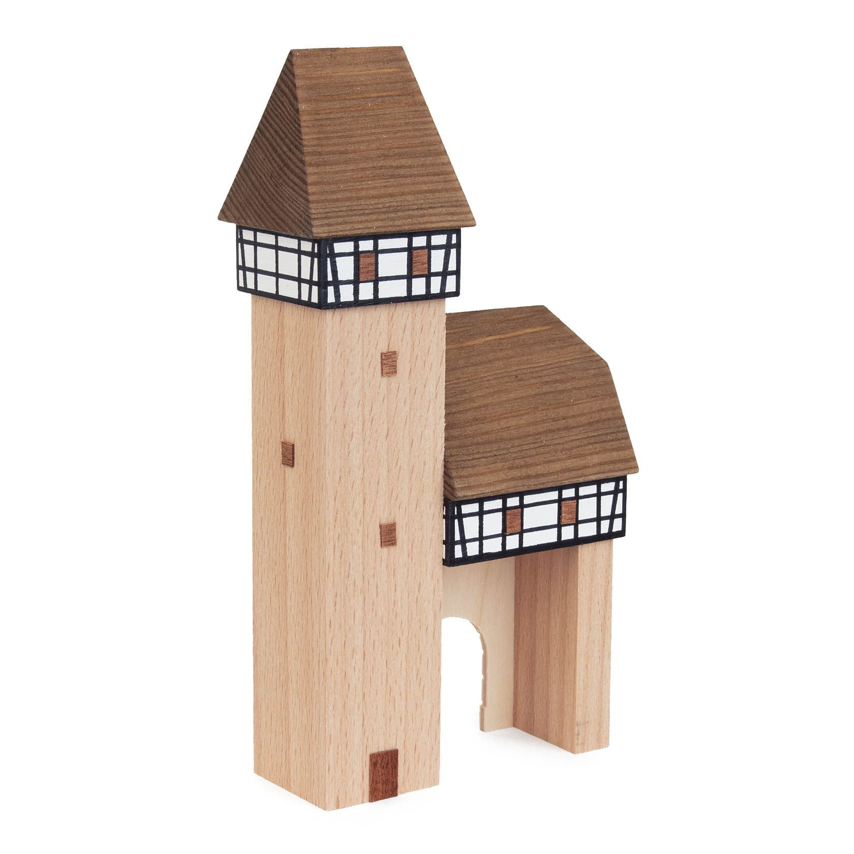 A wooden model of a city gate with a tower featuring a brown roof and black-and-white pattern. The structure resembles traditional German architecture.