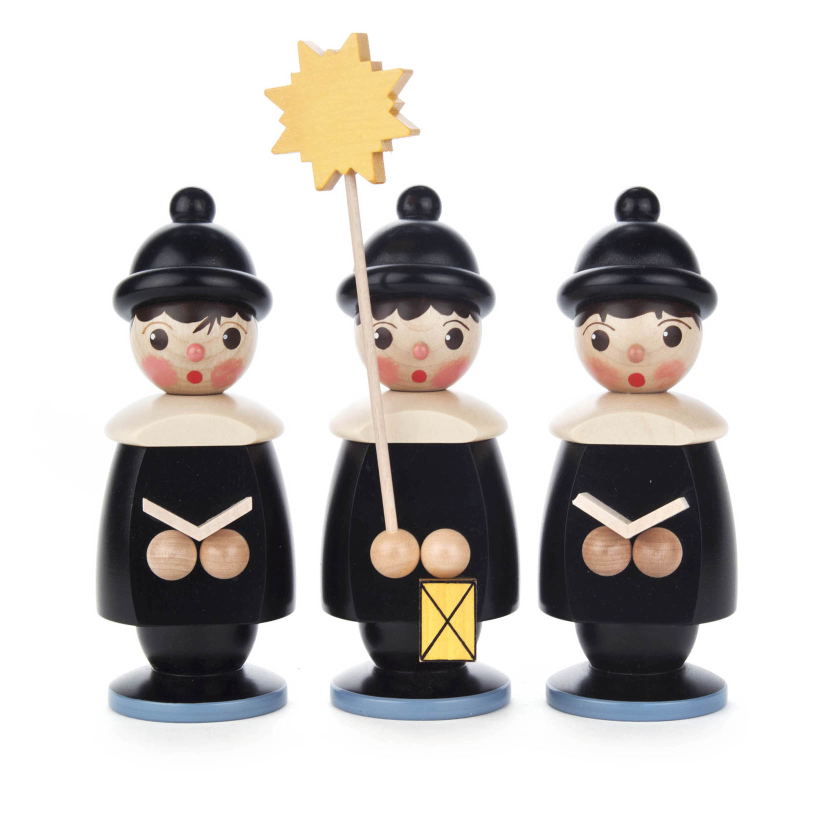 Drei schwarze Kurrendefiguren aus Holz mit runden Hüten, eine Figur hält einen Stern. Alle haben rote Wangen und halten ihre Hände vor sich. im Dregeno Online Shop günstig kaufen