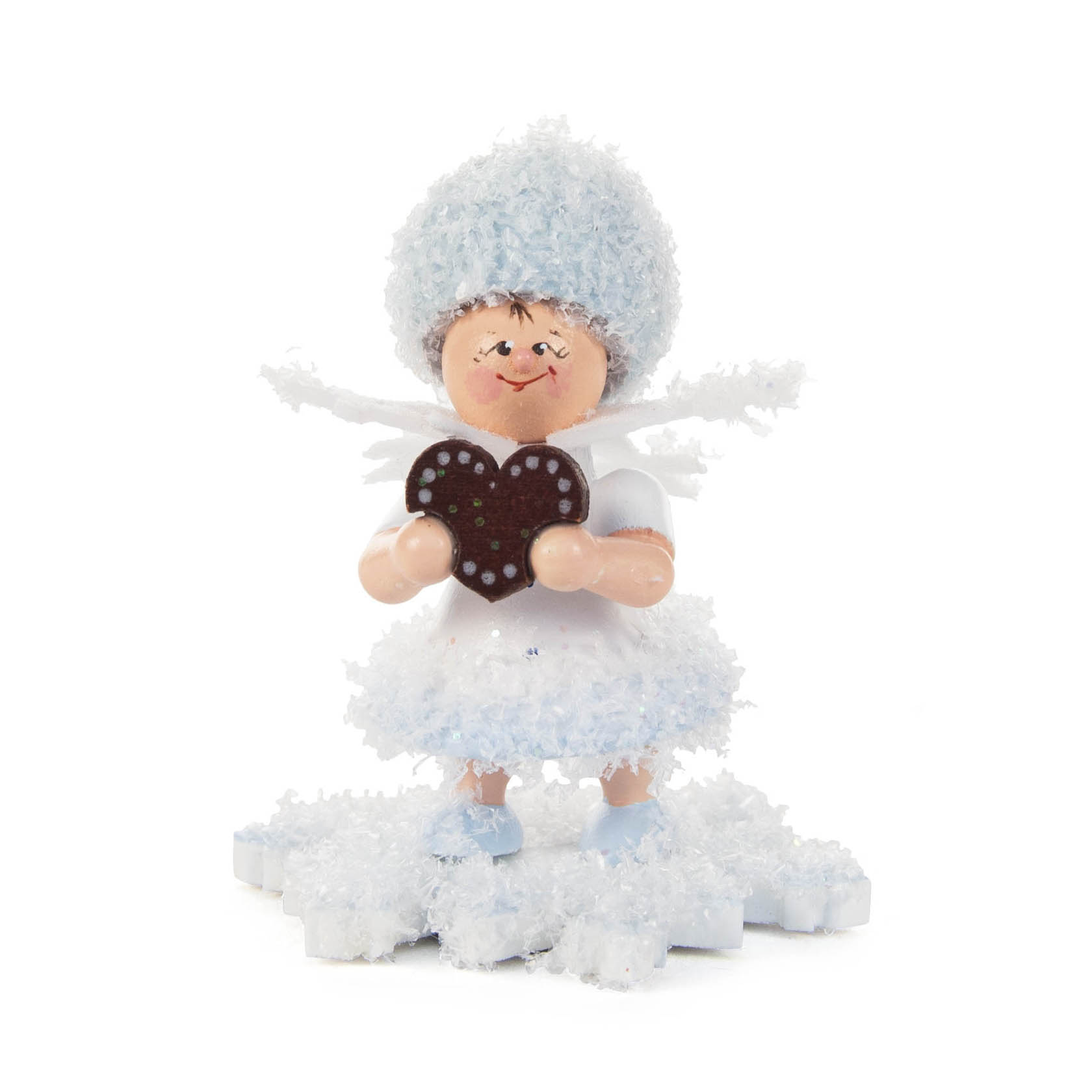 Puppenfigur mit weißem Kleid und Mütze, hält ein Lebkuchenherz. Steht auf Schneeflocke und hat rote Wangen. im Dregeno Online Shop günstig kaufen