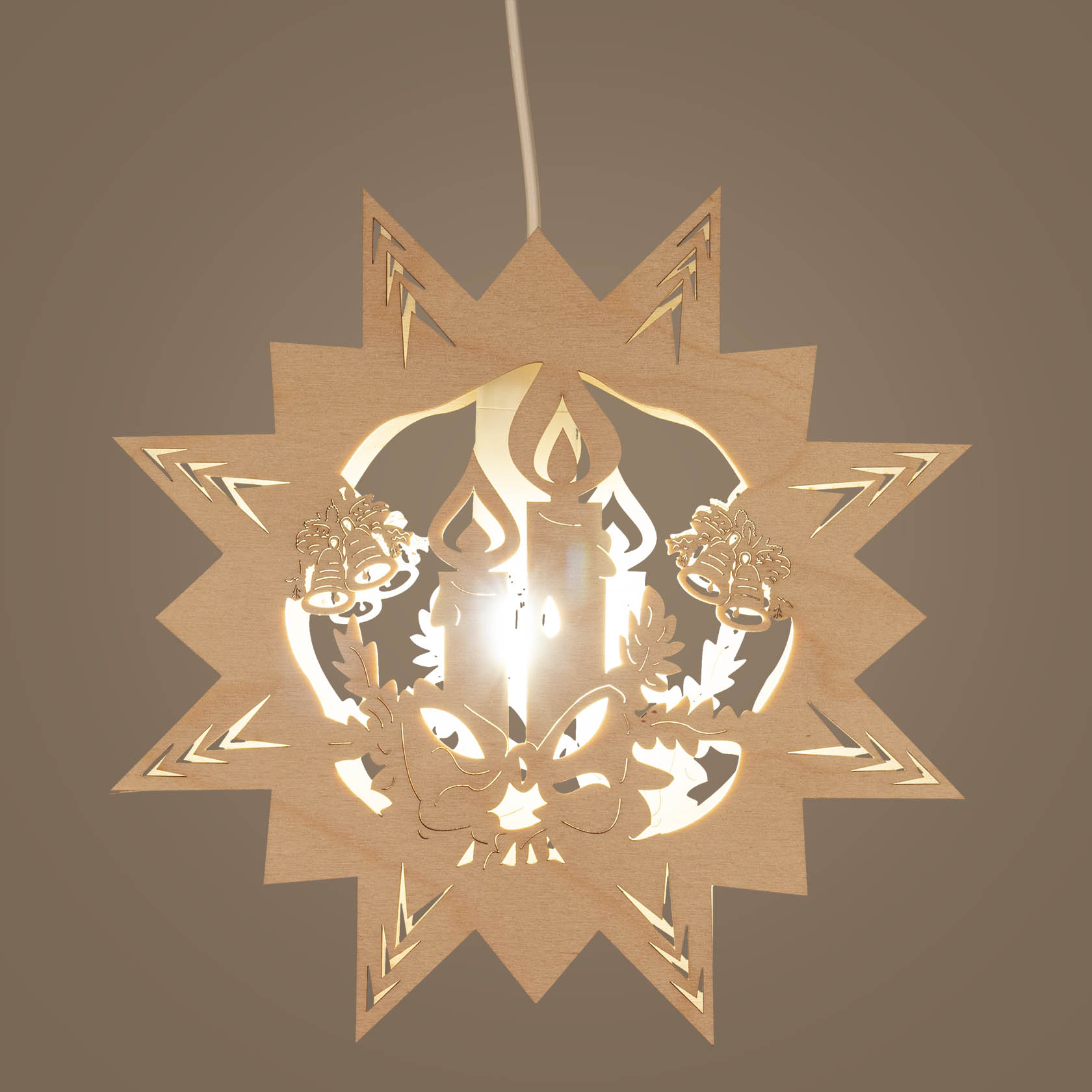 Wooden star-shaped window decoration with electric light, featuring a carved candle and two bells in the center.