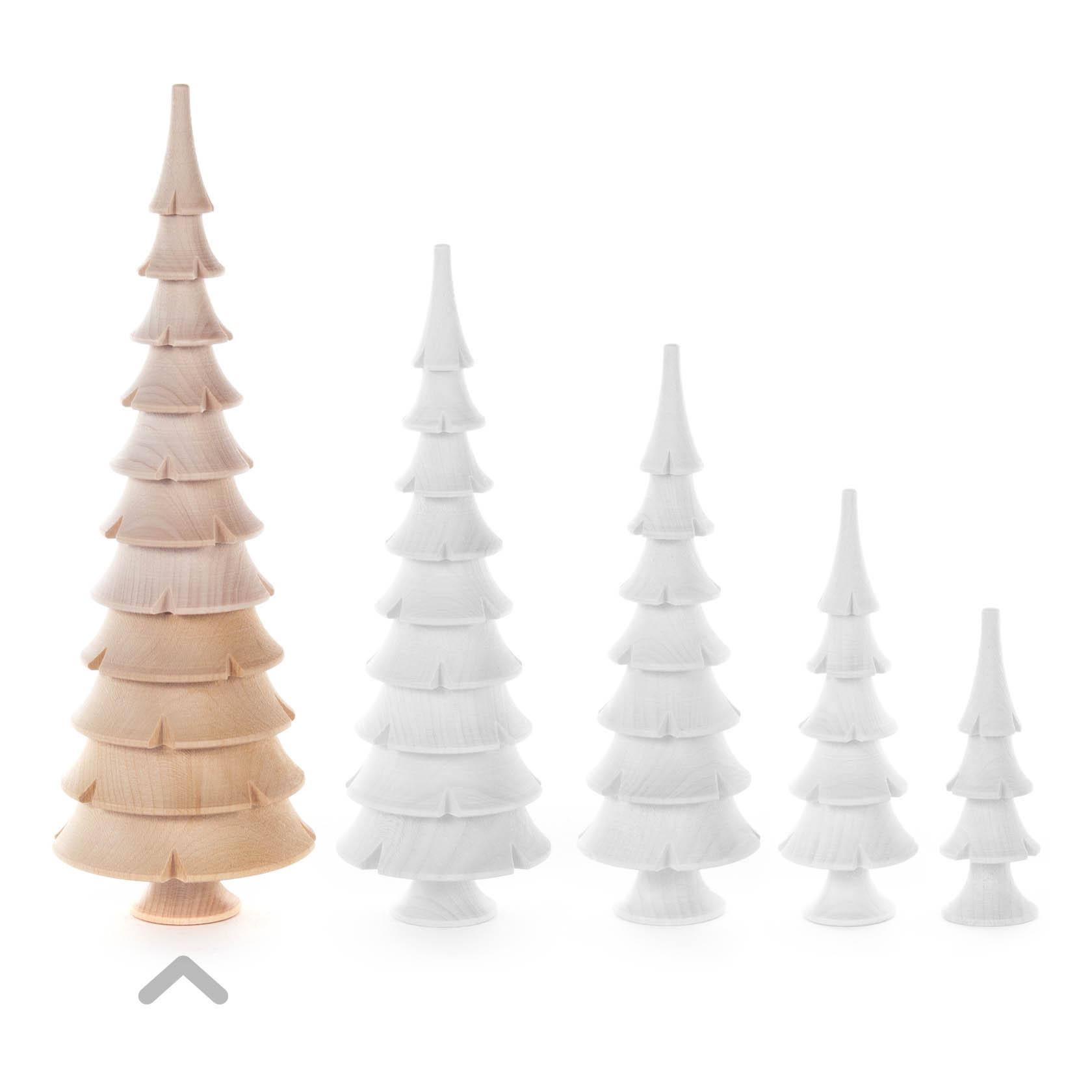 Five wooden trees of varying sizes, one in natural wood color and four painted white, arranged in a line from largest to smallest.