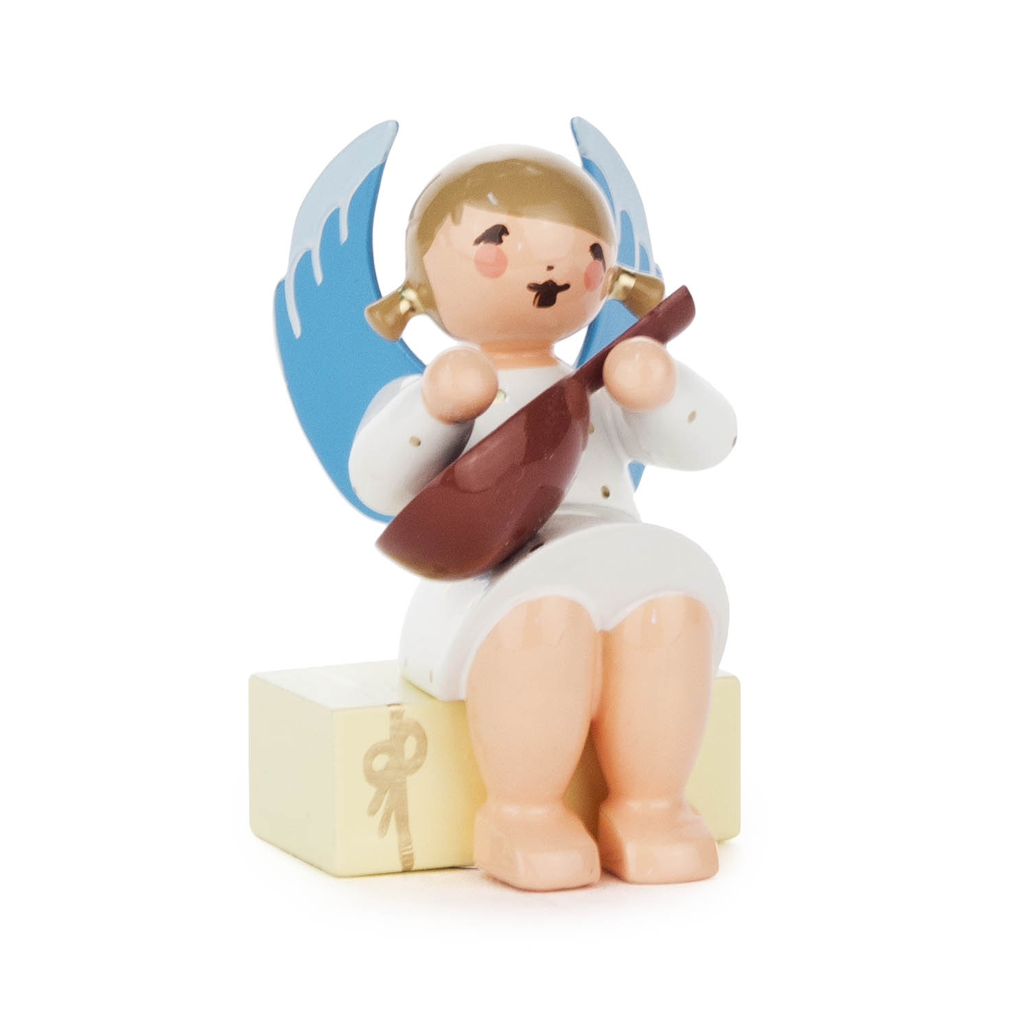 Engel mit Mandoline auf Geschenkpaket sitzend im Dregeno Online Shop günstig kaufen