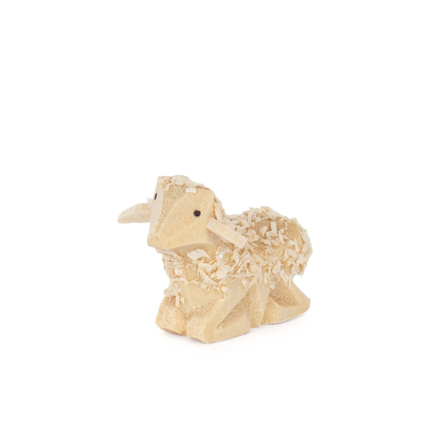 Holzfigur eines liegenden Schafs, etwa 1 cm hoch, mit erkennbaren Beinen und Gesichtszügen, in natürlicher Farbgebung. im Dregeno Online Shop günstig kaufen