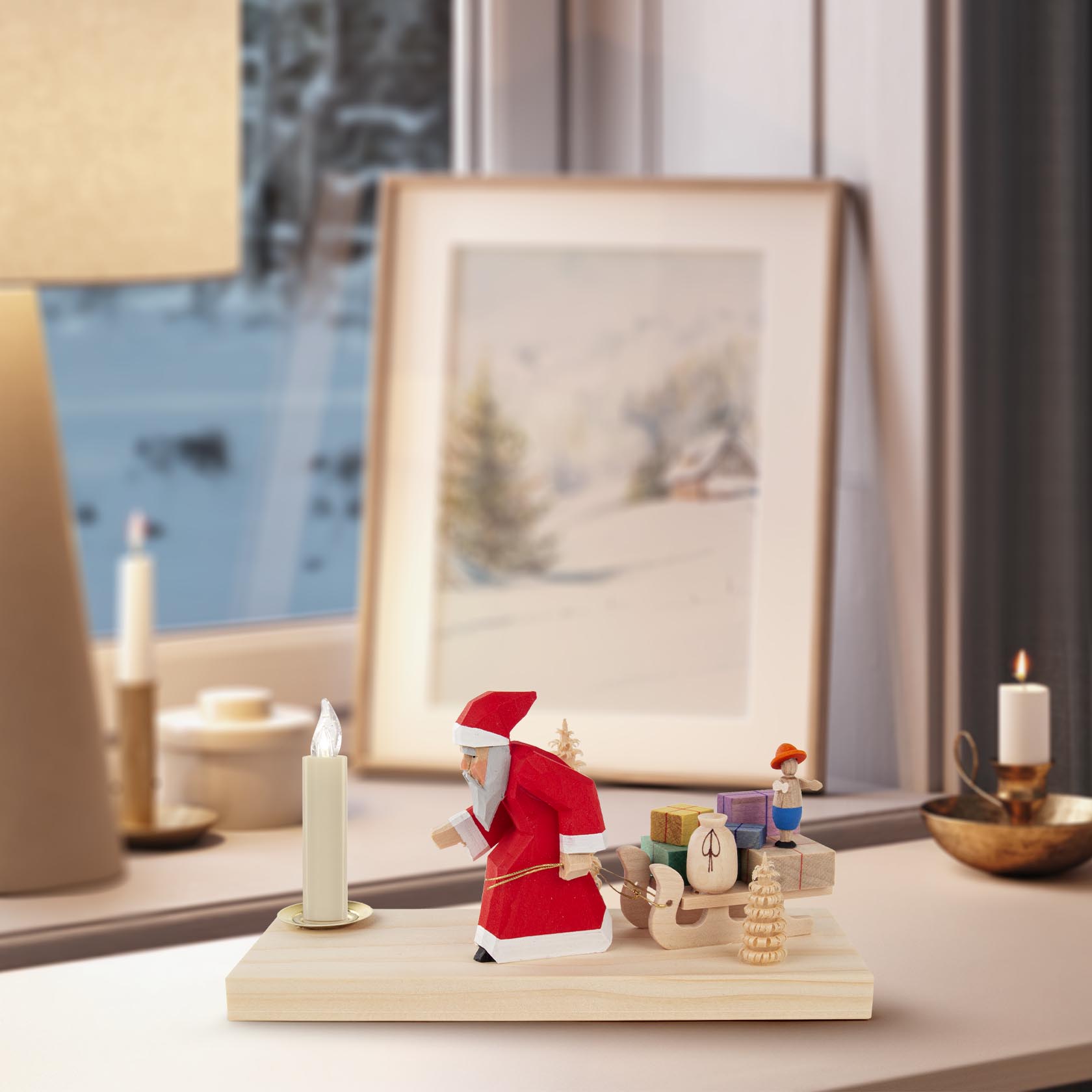 A carved wooden Santa Claus pulling a sled loaded with wrapped gifts and a small figure, designed to hold a 14mm candle.