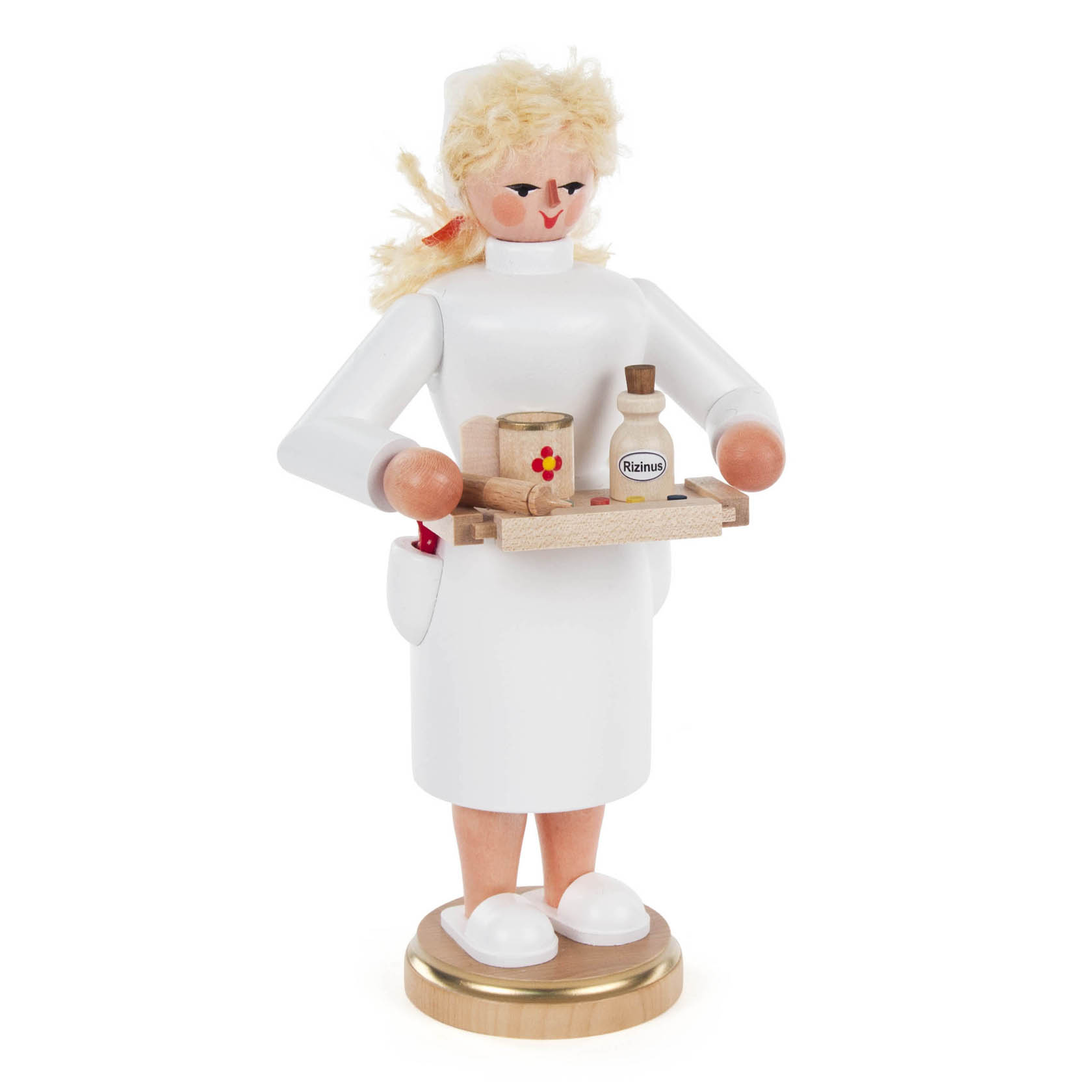 Eine aus Holz gefertigte Räucherfigur in Form einer Krankenschwester mit blonden Haaren, die ein Tablett mit kleinen Arzneiflaschen und Papierrollen hält.