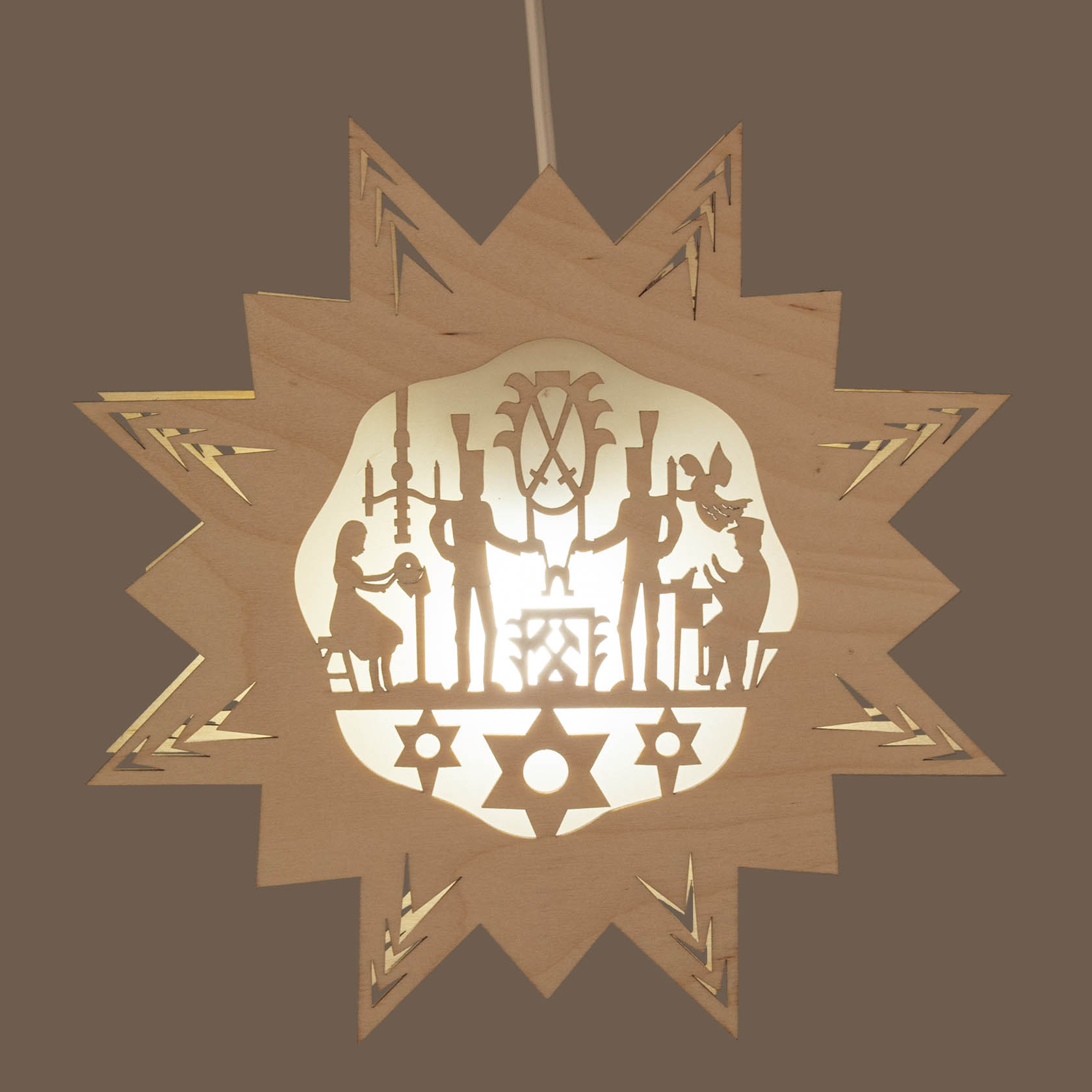 Wooden star-shaped window decoration 'Erzgebirge' with paper backing and electric lighting, featuring figures holding candles and festive motifs.