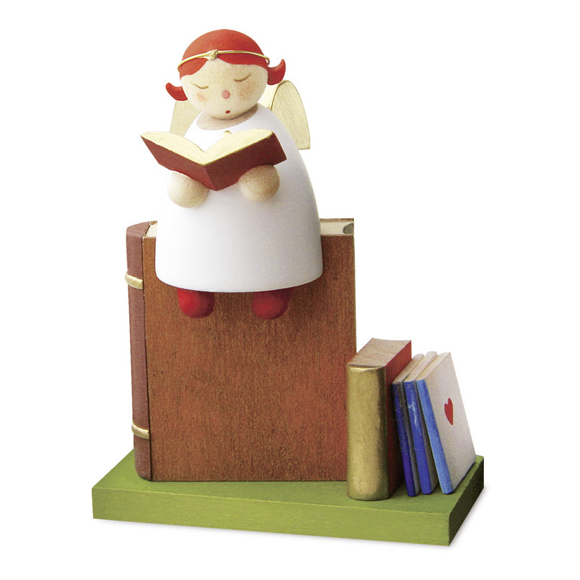 Schutzengel lesend auf Buch  