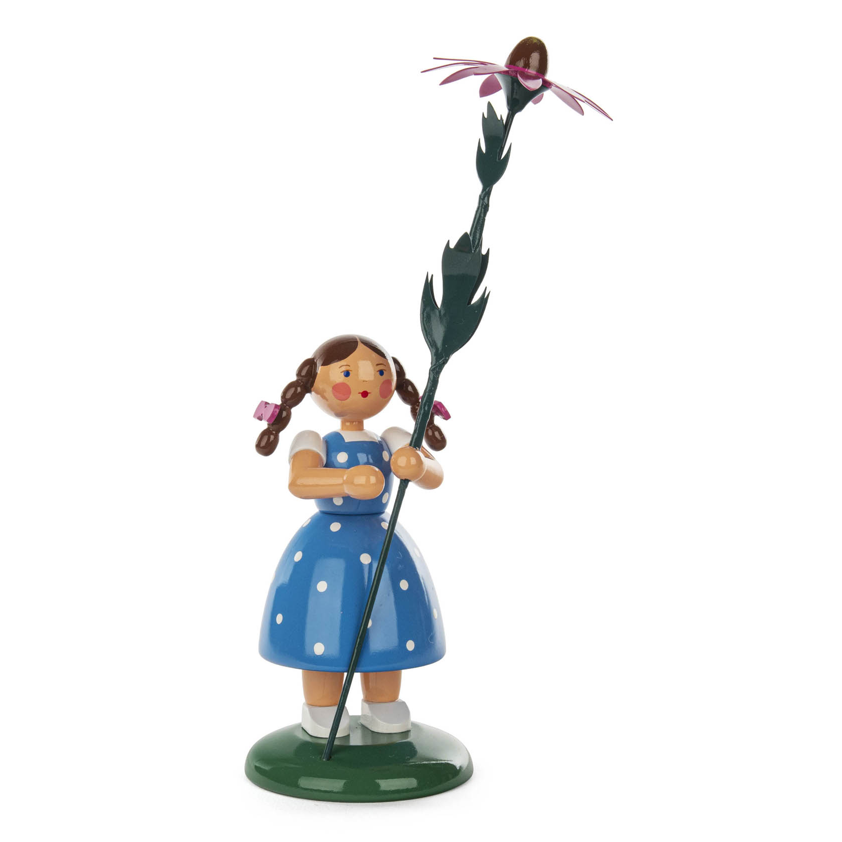 A wooden figurine of a girl wearing a polka-dot blue dress and holding a tall flower with a red petal, adorned with a wide-brimmed sun hat. im Dregeno Online Shop günstig kaufen