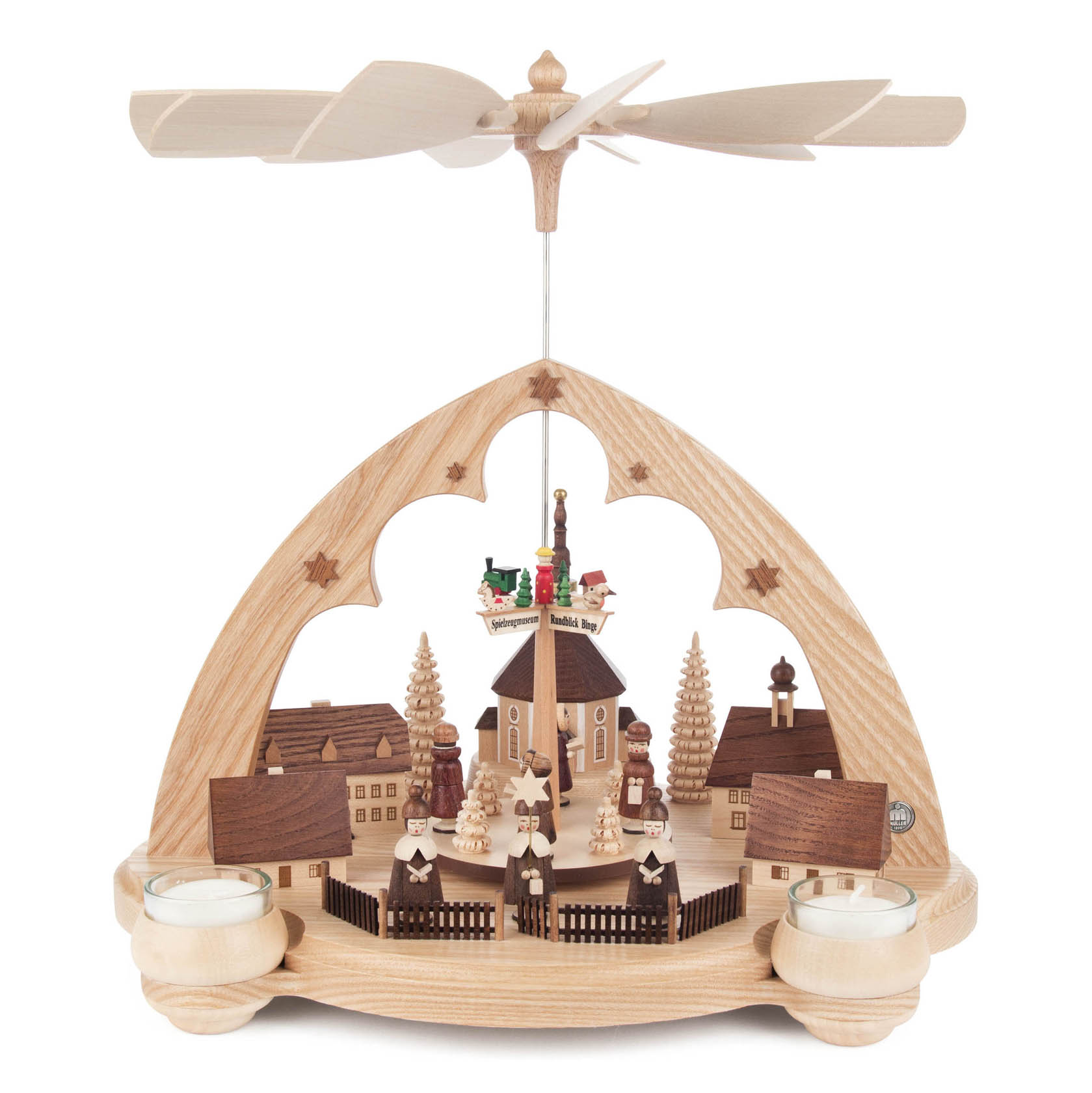 A wooden pyramid with a Seiffen village scene, featuring a church, houses, and figures, designed for tea lights. im Dregeno Online Shop günstig kaufen