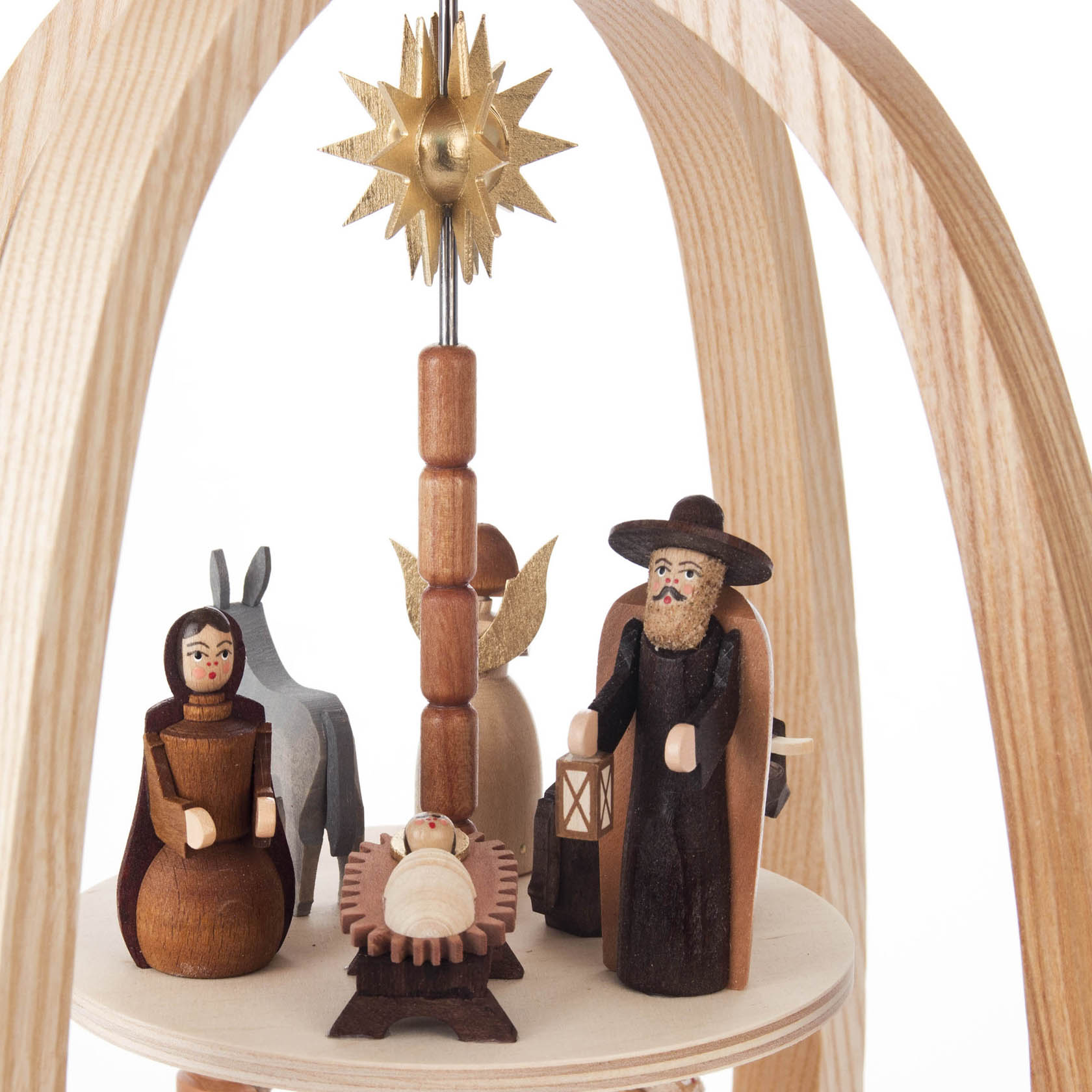 Two-tiered wooden Christmas pyramid featuring the nativity scene with Mary, Joseph, baby Jesus, a donkey, an angel, and a guiding star.