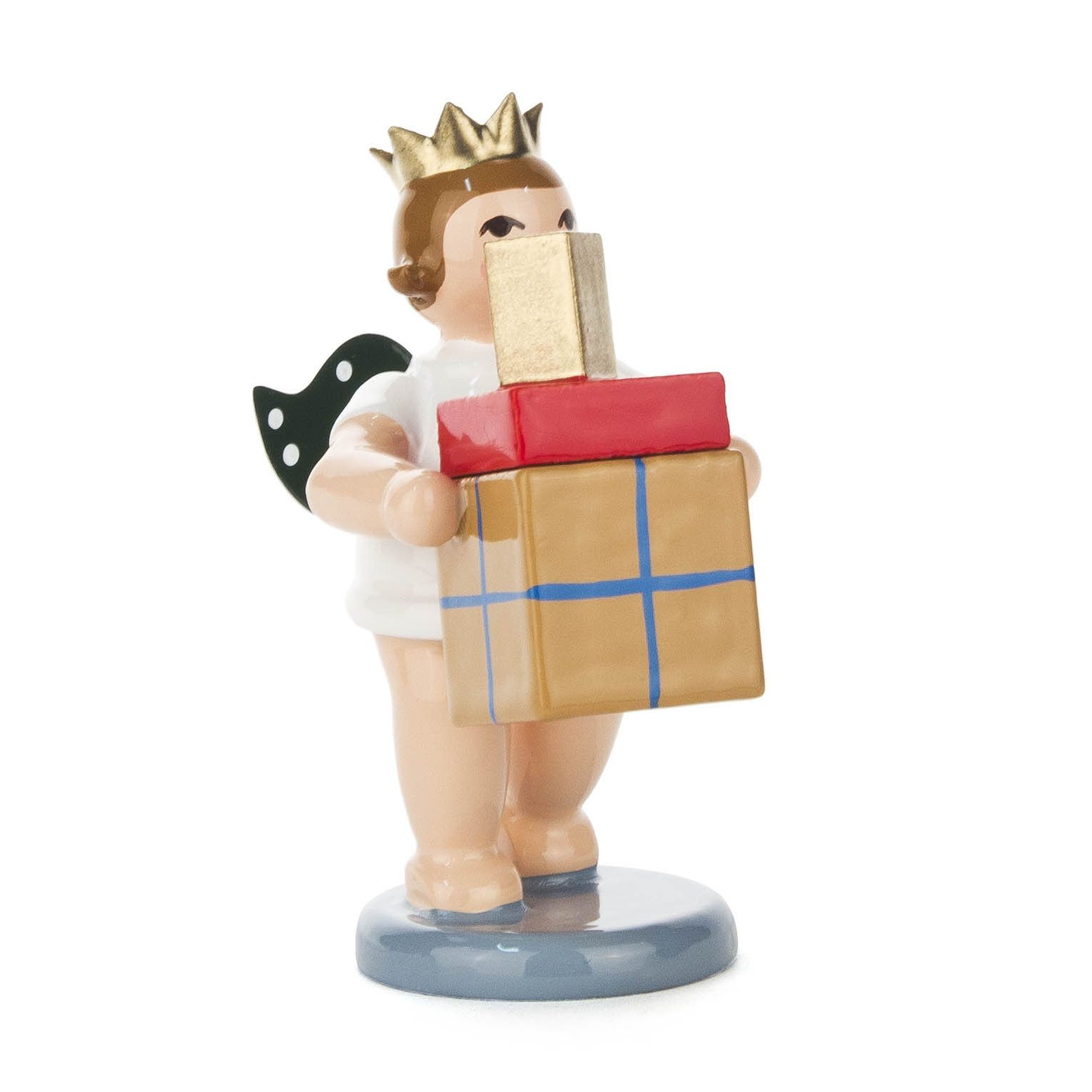Figurine of an angel with a golden crown, holding two wrapped gifts, one gold and one red, standing on a blue base.