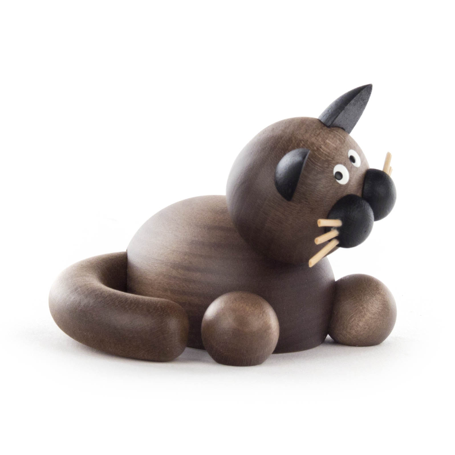 A wooden cat figurine with a dark brown finish, featuring a smooth rounded body, small pointed ears, and a curved tail.