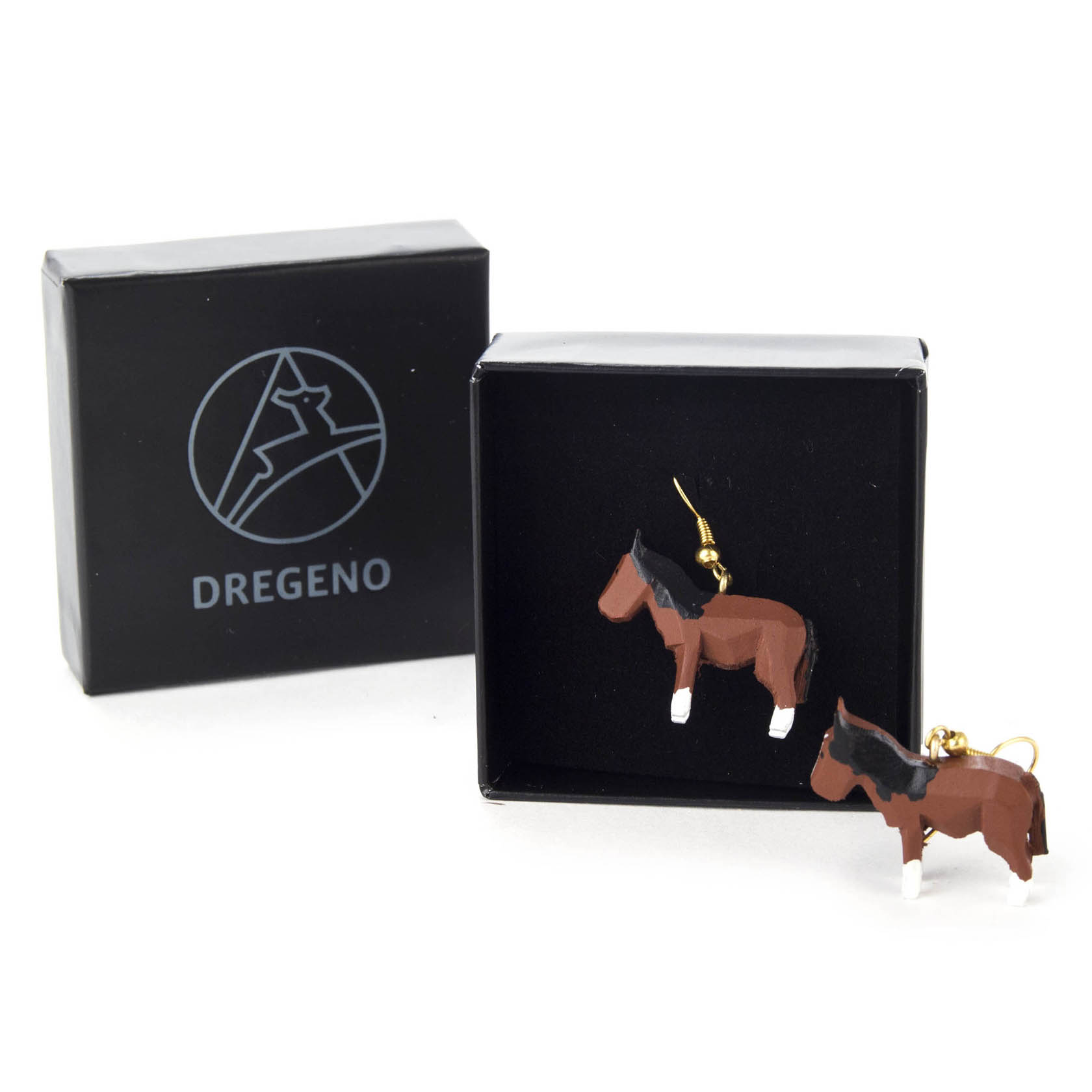 Two horse-shaped earrings in brown color inside a black jewelry box. The box features DREGENO logo.