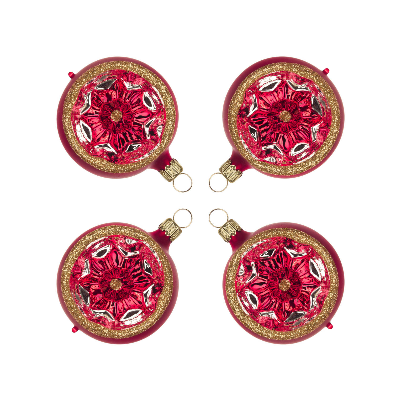 Four red-matte and gold glitter Christmas ornament balls, each with a reflective star-like design in the center.