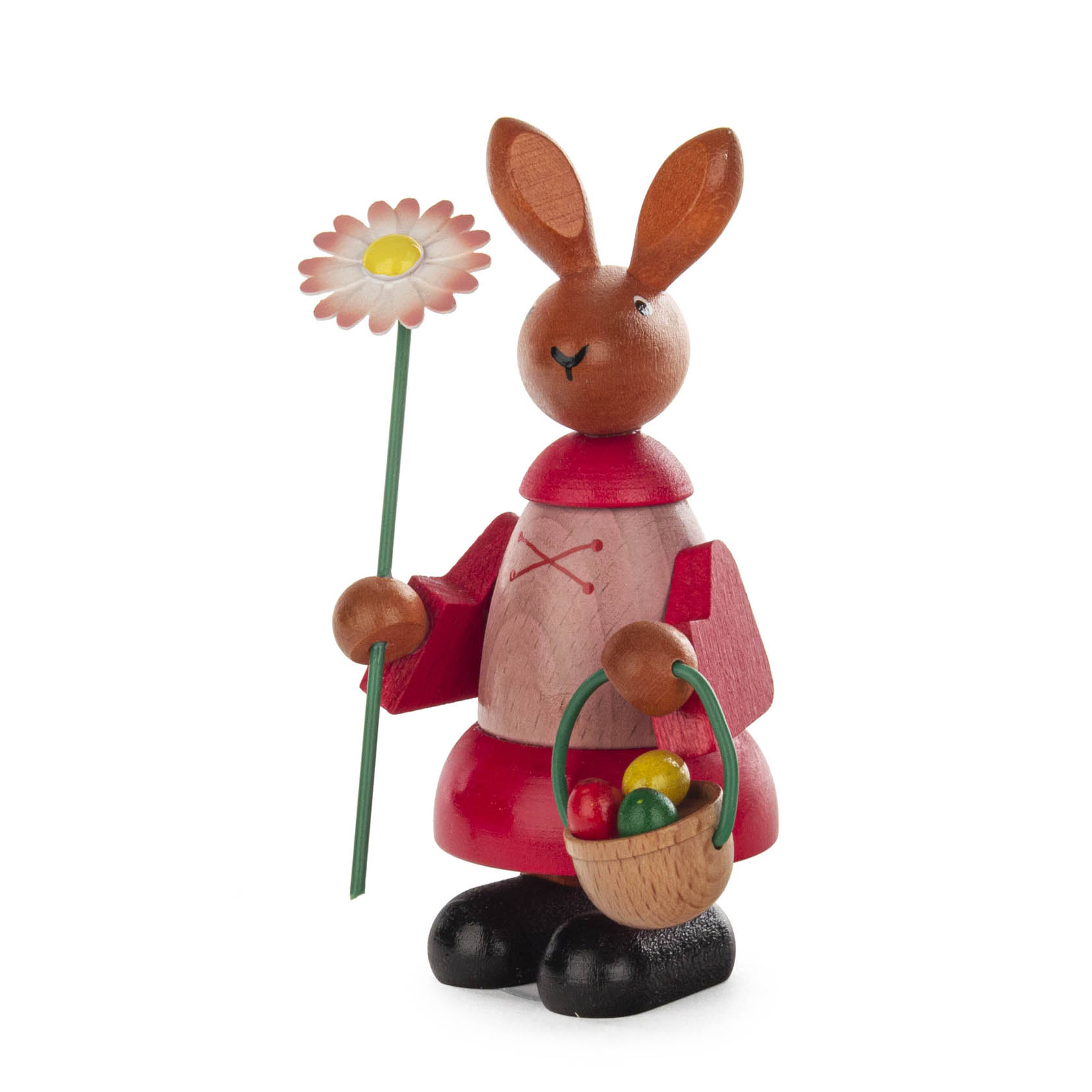 A 11cm tall wooden Easter bunny figurine wearing a red dress, holding a pink daisy and a basket with colorful eggs. im Dregeno Online Shop günstig kaufen