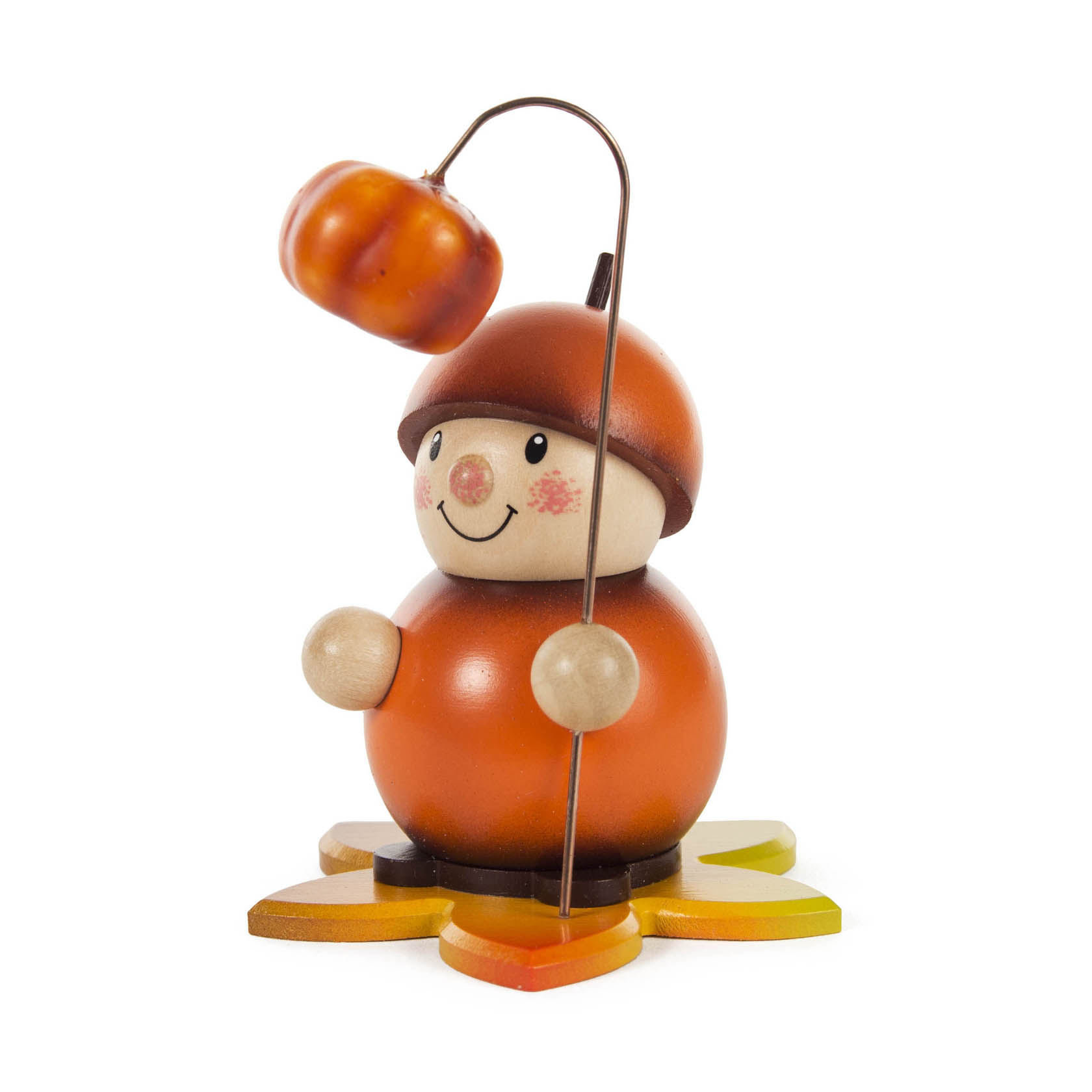 Ein kleines Kürbismännchen aus Holz, das einen kleinen Kürbis an einem Stab hält. Es hat eine orangefarbene Mütze und steht auf einem sternförmigen Podest. im Dregeno Online Shop günstig kaufen