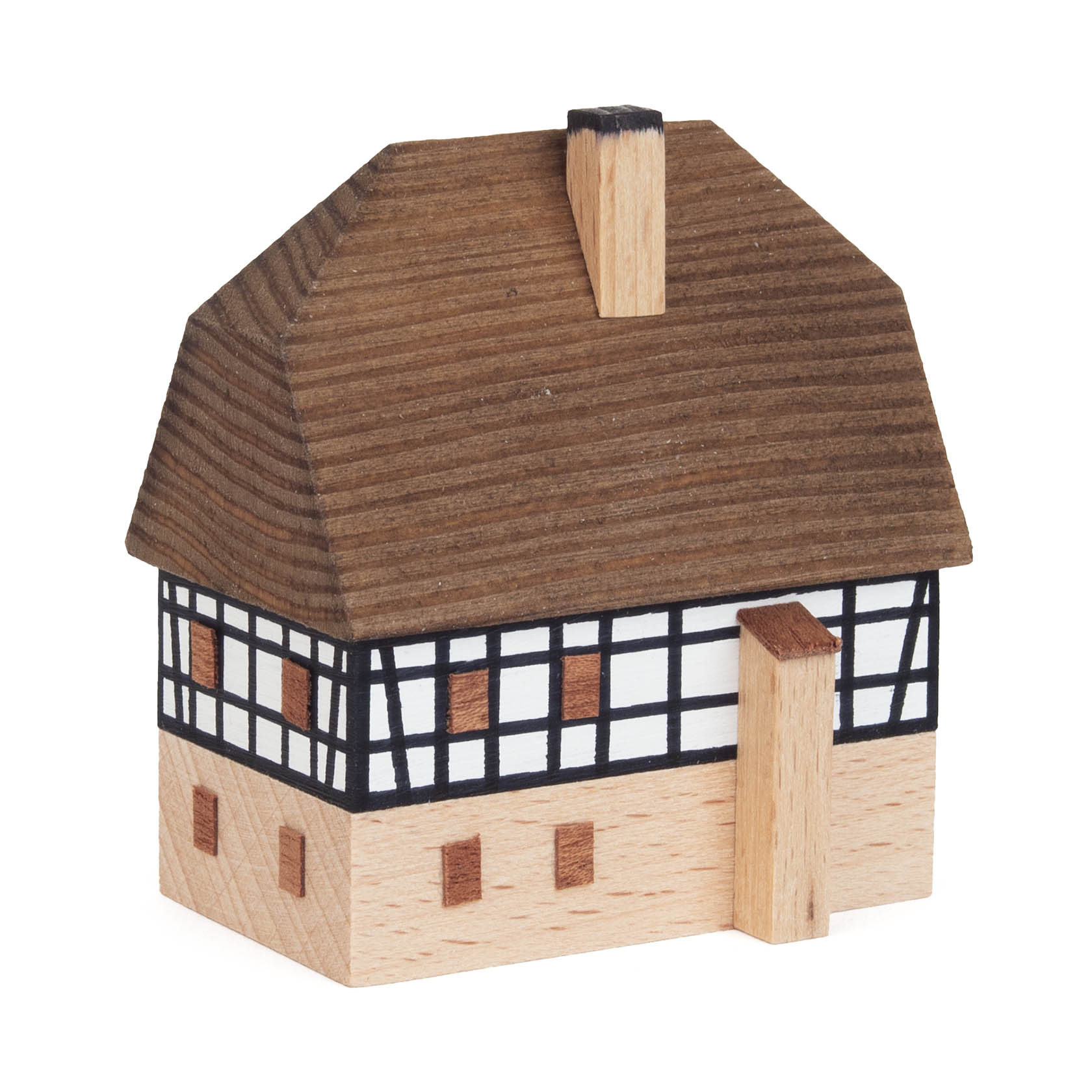 Small wooden model of a two-story village store with timber frame design and brown roof.