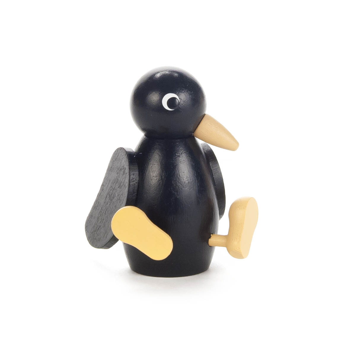 A wooden figurine of a bird, painted black with a large, round body, small wings, and oversized beak and feet, designed in a minimalist style.