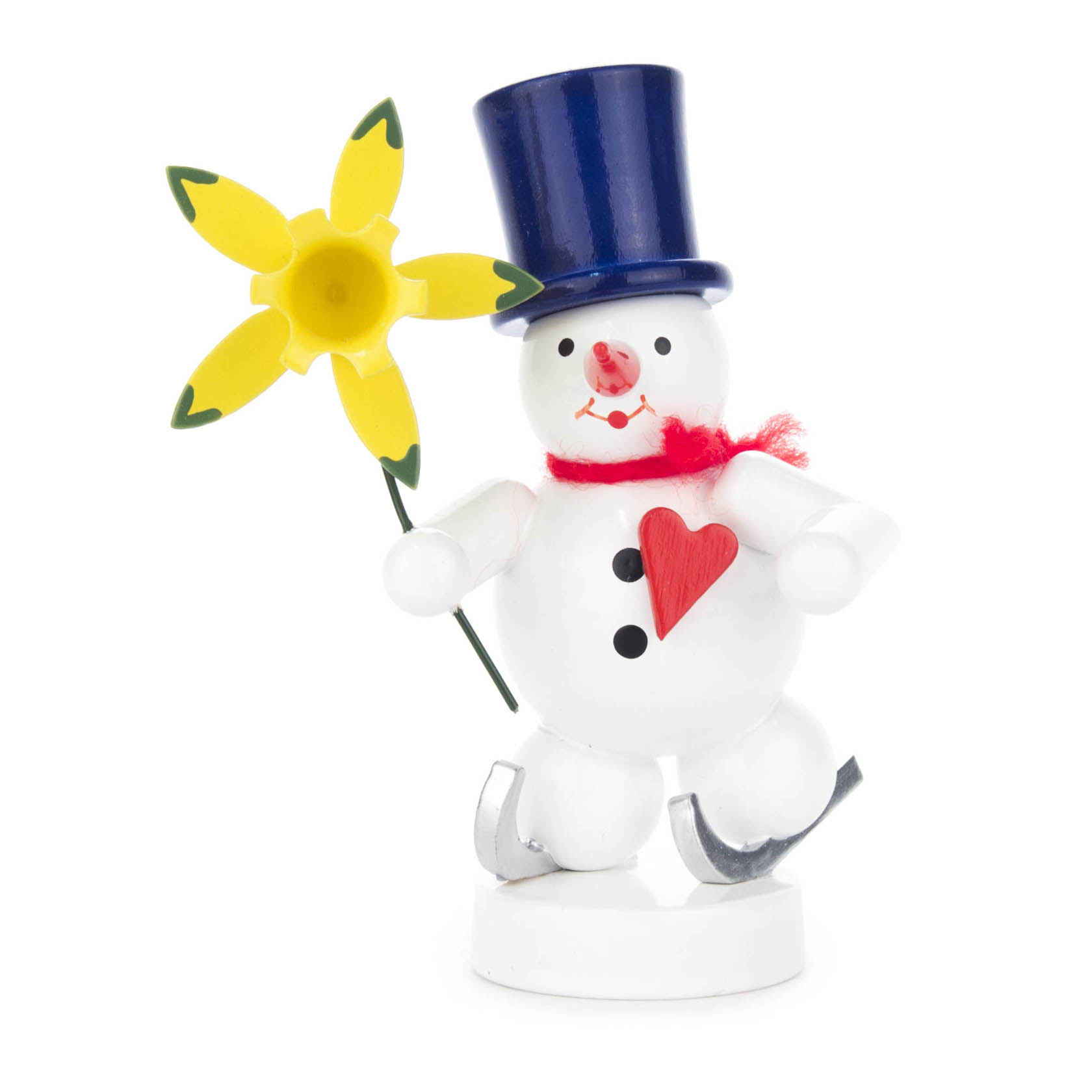 Niedlicher Schneemann aus Holz mit blauem Zylinder und rotem Herz, hält eine gelbe Narzisse. Der Schneemann steht auf Schlittschuhen.