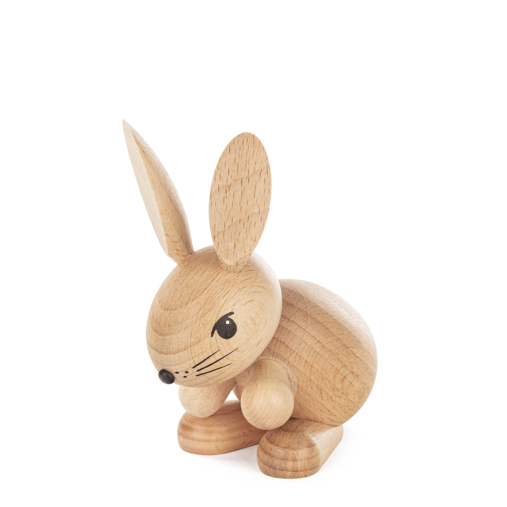 Wooden figurine of a rabbit named 'Hermine' in a light natural wood finish. The rabbit is in a crouched position with large ears and a simplistic design. im Dregeno Online Shop günstig kaufen