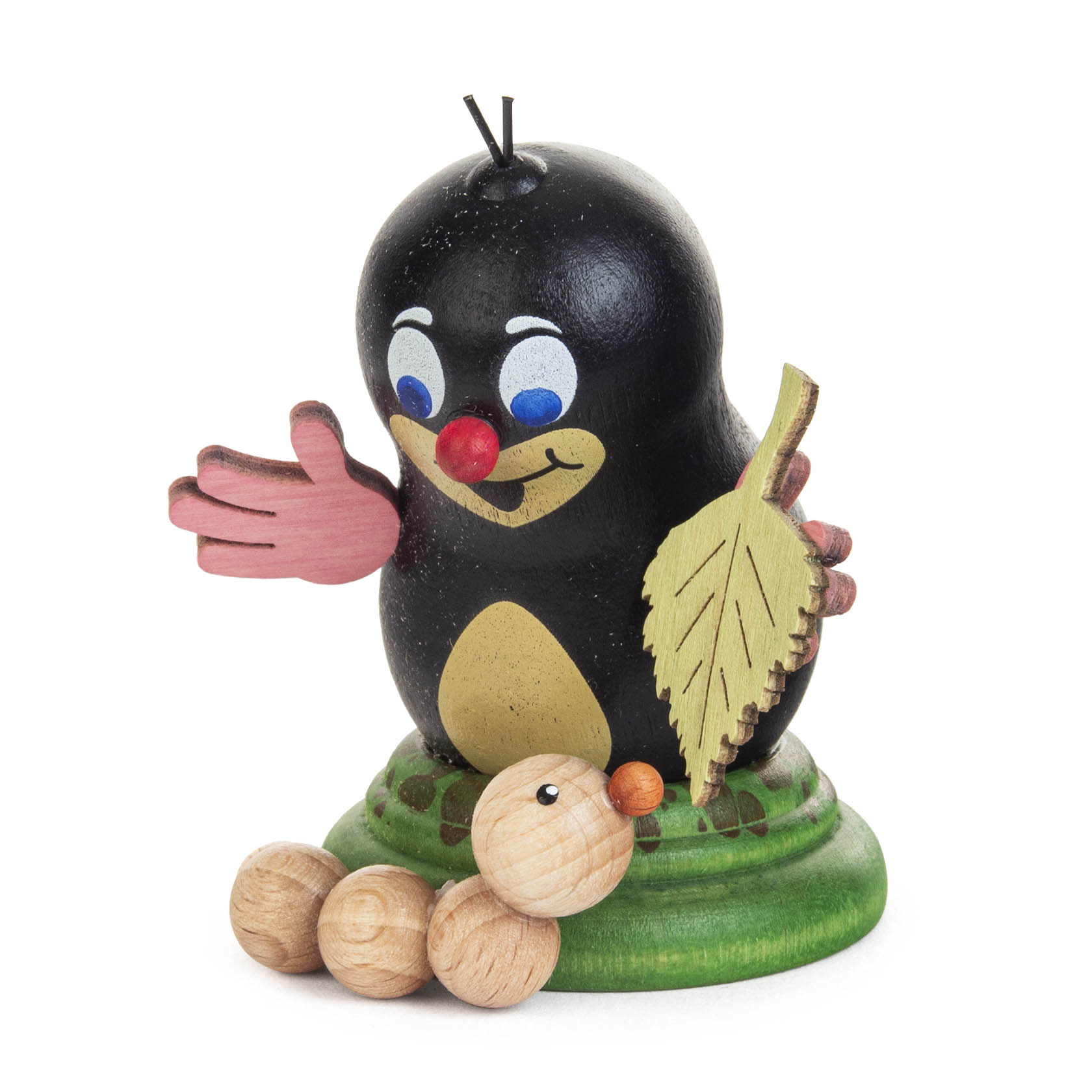 Holzfigur eines freundlichen Maulwurfs mit roten Händen und Nase, hält ein Blatt in der Hand. Vor ihm liegt ein Holzwurm mit orangefarbener Nase. im Dregeno Online Shop günstig kaufen